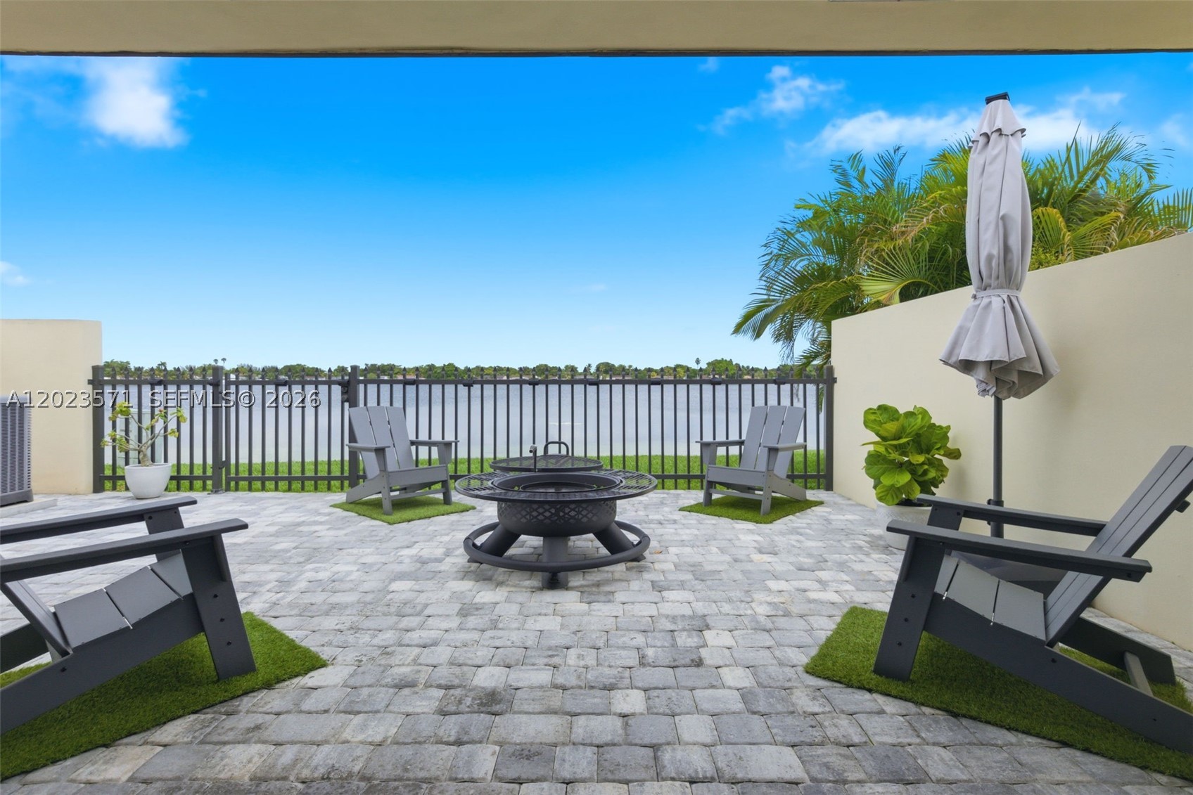 BEAUTIFUL CORNER UNIT WITH BREATHTAKING WIDE LAKE VIEWS! THIS MOVE-IN-READY HOME HAS BEEN COMPLETELY REMODELED AND IS LOADED WITH MAJOR UPGRADES, INCLUDING A NRAND NEW ROOF, IMPACT WINDOWS AND DOORS, NEW WATER HEATER AND NEW KITCHEN APPLIANCES. Enjoy peace of mind and modern comfort while taking in the tranquil lake views from this beautifully updated home. Located in a quiet, well maintained neighborhood surrounded by lush landscaping, this property also features a wide driveway  with space for up to 3 cars. DON'T MISS THIS RARE OPPORTUNITY TO OWN A FULLY UPGRADED HOME WITH STUNNING WATER VIEWS.
