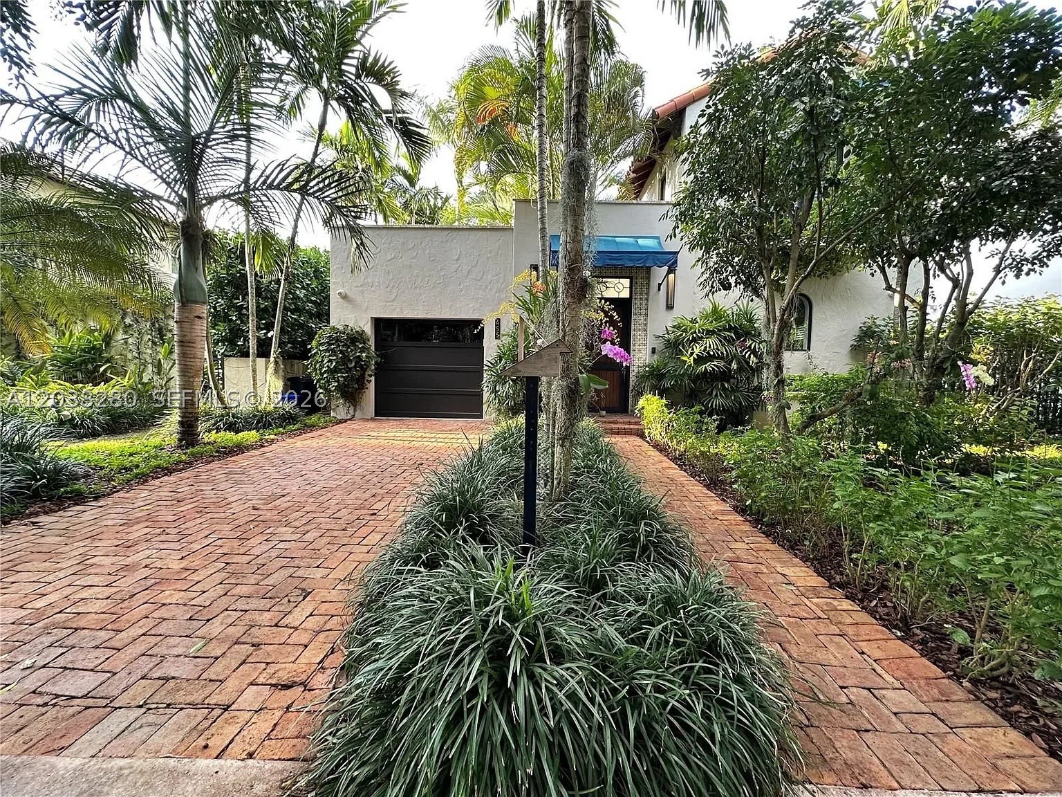 Beautifully updated 3-bedroom, 2.5 bath in the prime location of Coral Gables, Merrick Park, U of M and Downtown.  This home includes a 1-car-attached garage with AC, washer & dryer, "EV" electric vehicle charging station and epoxy resin floors. Enjoy your chef’s kitchen that includes a gas range, propane gas water heater, under-counter beverage cooler, built-in microwave. Upstairs has wood floors and many special features in the primary suite such as built-in work desk, and LG styler clothes steamer in primary closet. Second floor AC has a dehumidifier. There are impact glass windows and electric window treatments throughout this beautiful home. Security camera and system available (at tenants’ expense). All APPLIANCES ARE FROM 2019 Remodel. AC units age 2019 and 2021. Upstairs deck with new wood floor terrace and lush garden views. Yard maintenance, garbage and septic maintenance included in rent. Tenants are responsible for all utilities. DON’T miss this opportunity, Available now!!