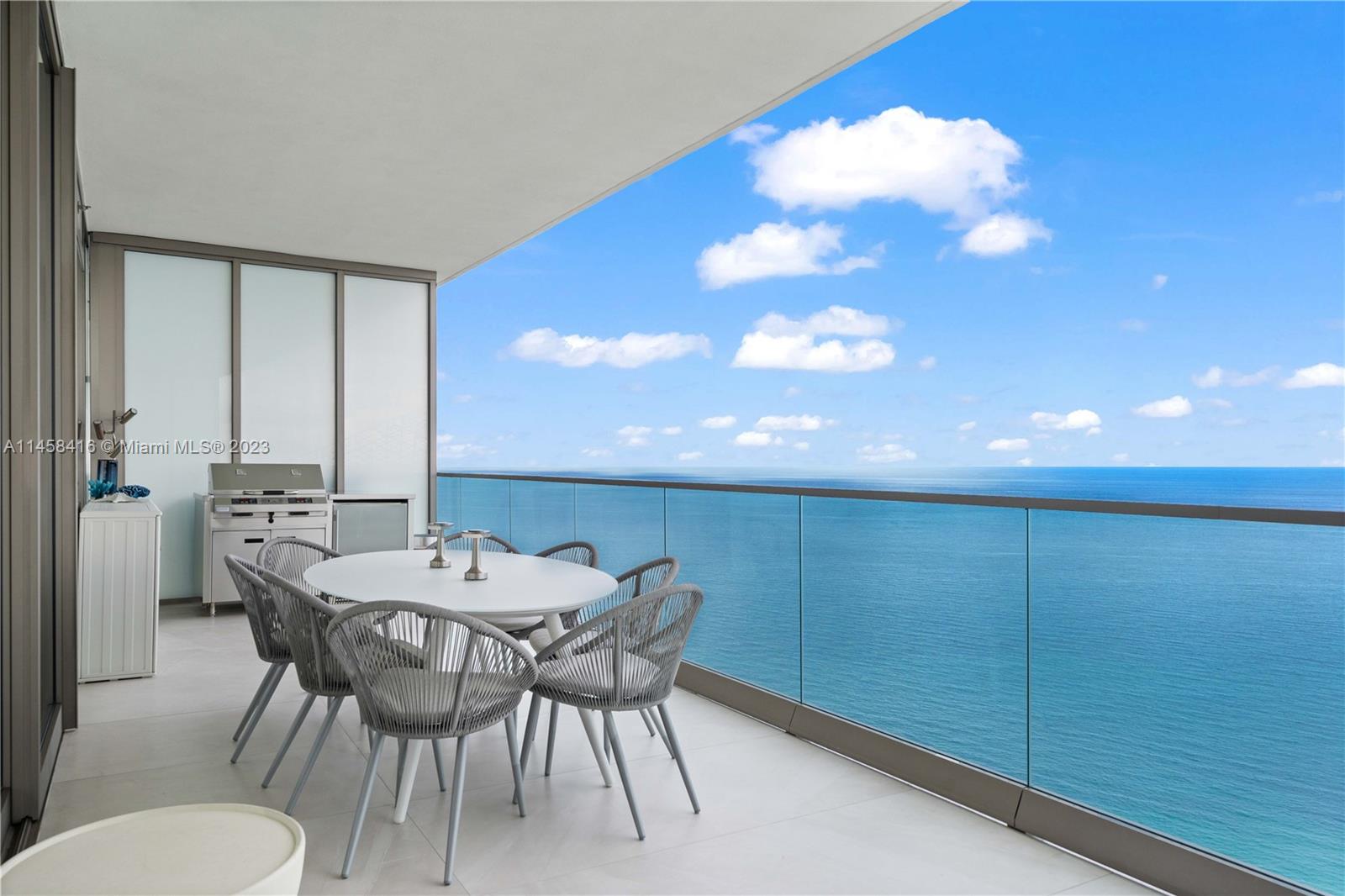 Experience Breathtaking Ocean Views from this four-bedroom, five-and-a-half-bathroom Armani Casa masterpiece. This exceptional unit with an incredible flow-through design, featuring two expansive balconies that provide stunning views to the East and West. Floor-to-ceiling glass windows flood the interior with natural light and offer panoramic views of the ocean. The kitchen is a modern marvel, featuring European-inspired cabinetry, a central island, top-tier ovens, a Sub-Zero refrigerator, and a wine cooler. Enjoy state-of-the-art amenities such as restaurants, a bar, pool, business center, spa, fitness center, theater room, cigar and wine room, children's play area, security, concierge, and valet parking. Don't miss the chance to see this must-see unit!