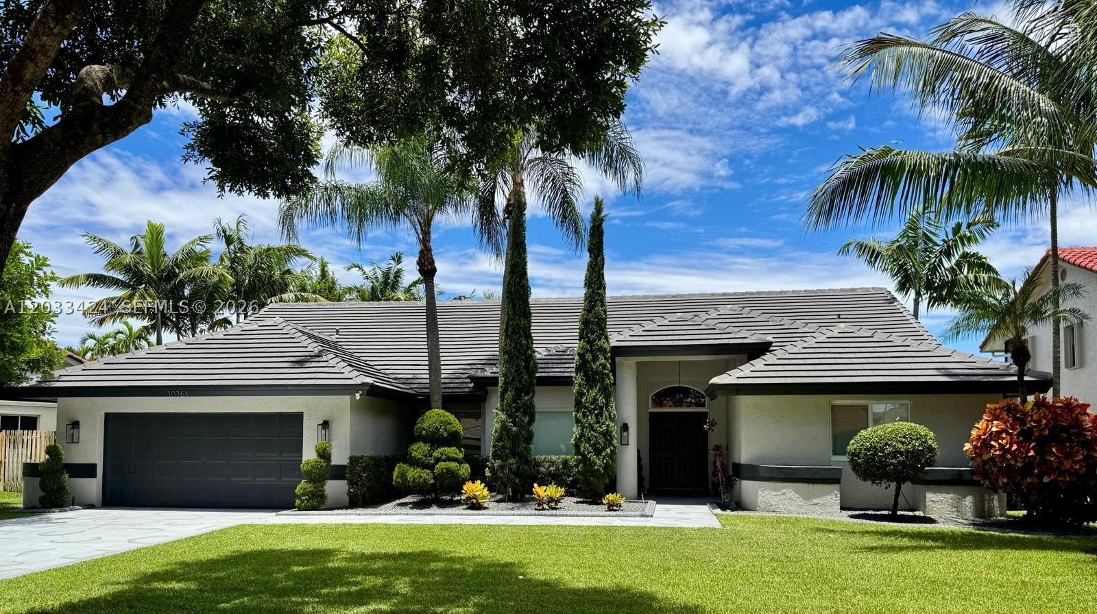 Exceptional water view home nestled in the highly sought-after Westport community of Plantation — where designer finishes, a screened saltwater pool, and a show-stopping water vista come together effortlessly. This beautifully updated 4-bedroom, 2.5-bath residence offers a stacked floor plan that maximizes every square foot, anchored by a stunning coral fireplace in the family room and flooded with natural light from a new skylight (2025).

The home has been meticulously maintained and thoughtfully upgraded: dual A/C units (2023), tile roof (2019), full hurricane impact windows and doors, RO water purification system, new interior doors throughout, and an epoxy-finished garage (2025) with a new motor (2026). The kitchen features a new dishwasher (2024), and the laundry is equipped with a new washer and dryer (2025). Outside, enjoy a heated saltwater pool with a new pump (2026), all within a screened enclosure overlooking peaceful water — your own private retreat.

Investors and primary buyers alike will appreciate the turnkey condition and low-maintenance upgrades already in place. Located minutes from Fort Lauderdale-Hollywood International Airport, I-595, downtown Fort Lauderdale, Las Olas Boulevard, and Broward's finest beaches — this is Plantation living at its best in a family-friendly neighborhood with easy access to everything South Florida has to offer.