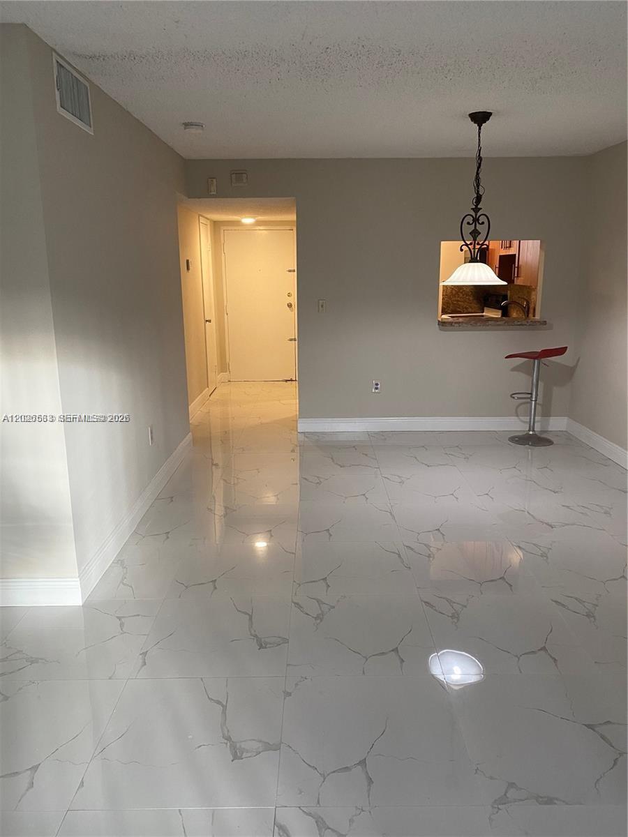 Wonderful ready to move in unit, freshly painted, beautiful marble like floors, renovated kitchen, close to shopping malls, turnpike and US1.