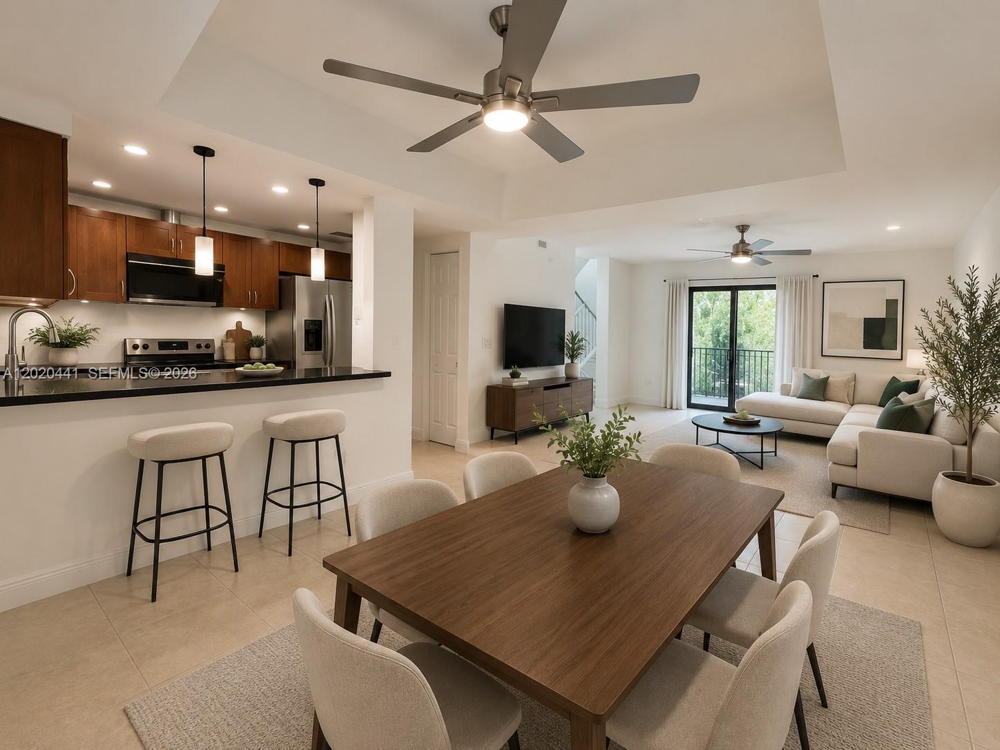 One-of-a-kind offering tri-level townhome in the heart of Coconut Grove just minutes from CocoWalk, shopping, dining, marinas, and a short drive to Coral Gables, Brickell, and Miami International Airport. This spacious townhome features 3 bedrooms with bathrooms, plus a powder room next to living area, most impact windows and doors, ceiling fans, tile floor, and 2-car garage with EV charging port ready. The open-concept living and dining area flows seamlessly to the kitchen, perfect for entertaining. Enjoy a private tropical patio, custom closets, and a gated community with low HOA fees. Major upgrades include a 3-year-old steel roof with a 50-year expected lifespan. A fantastic opportunity to enjoy Coconut Grove living at its best.