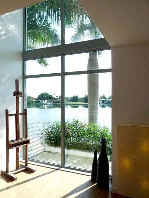 AMAZING BAY VIEWS FROM THIS LUXURY WATERFRONT 2400 sqft 3/3.5 + DEN TOWNHOME. Award winning, contemporary design in Normandy Isle. Walk to restaurants, beach. Light and spacious with wood floors and lots of outdoor space. Gated complex, private 2 car gara ge, bayfront pool. Next door to brand new golf course, tennis courts and children play area.
