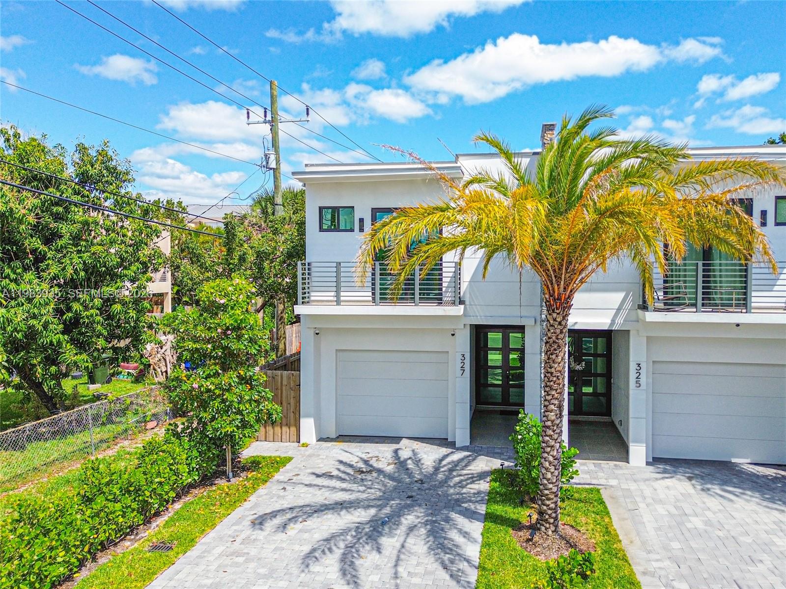 Discover modern elegance in this new Fort Lauderdale townhouse. Featuring 4 generous bedrooms and 4 sophisticated bathrooms, each with premium designer touches. The state-of-the-art kitchen, complete with high-end appliances, is a chef’s dream. Unwind by the sparkling saltwater, heated pool or host gatherings at the stylish outdoor kitchen. A sleek wet bar elevates the vibe, while the garage, with its polished epoxy floor and electric vehicle charger, adds convenience. Perfectly positioned near Las Olas Blvd, downtown, pristine beaches, and the airport, this home balances vibrant city access with serene coastal charm. Fully staged with a stunning summer kitchen for outdoor enjoyment. Property is rented until March 31st