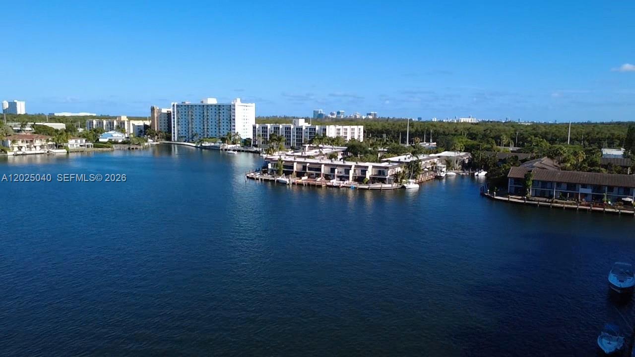 Stunning water views near Aventura! This totally updated condo in Reef Club East offers gorgeous views of Maule Lake and the skyline of Sunny Isles. Reef Club offers marina, 24 Hour gated security, tennis court, BBQ, gym and large pool. The apartment is a 1 Bed 1.5 bath that has been entirely remodeled. Porcelain floors, granite kitchen counters, and stainless steel appliances. Dock available for rent at low prices.