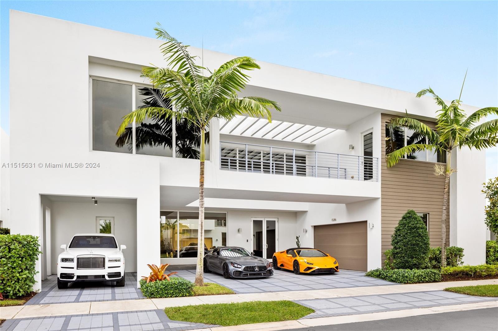 Located in Doral's prestigious Modern 75, the property at 10286 NW 75th Ter is a symphony of luxury and modern design. This 6-bed, 7-bath masterpiece boasts an open-concept living space with top-tier finishes. The chef's kitchen, with premium appliances and custom cabinetry, seamlessly flows into a vibrant outdoor area, featuring a summer kitchen ideal for entertaining. Each bedroom is a private retreat, especially the master suite with its spa-like bath and bespoke closet. Exclusive community amenities like a fitness center and clubhouse enrich the living experience, making this home a true emblem of sophistication.