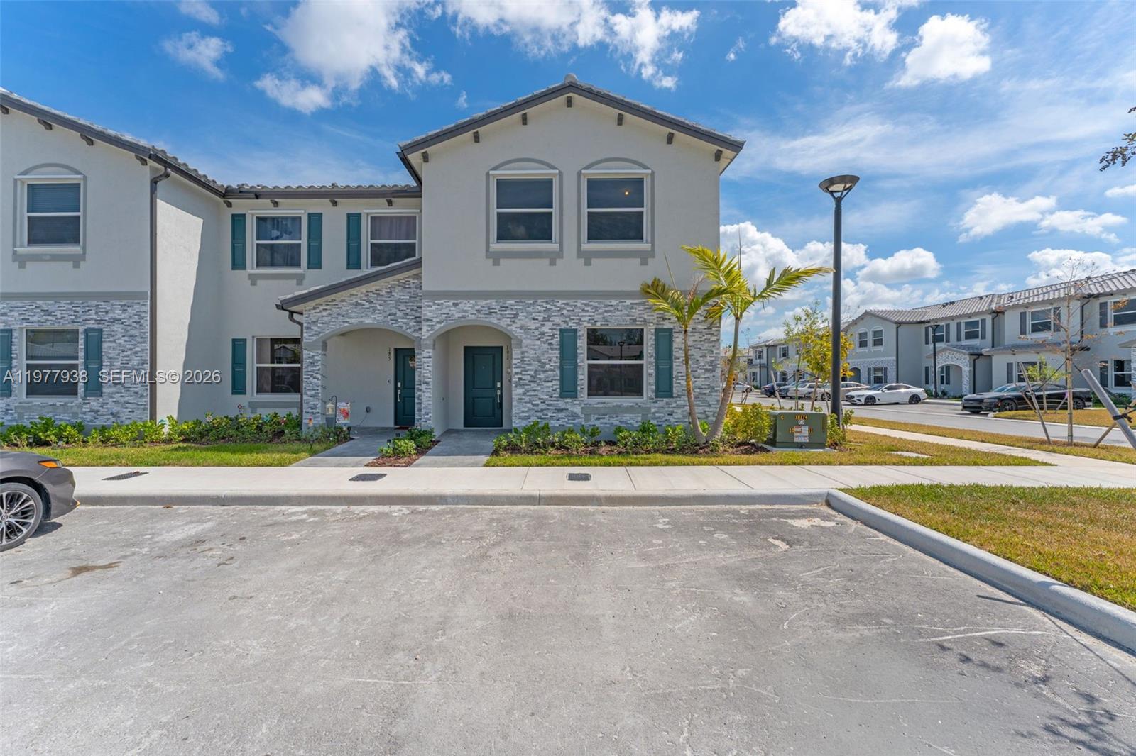 BRAND NEW! Be the first to live in this spacious corner townhouse featuring 4 bedrooms and 3 full bathrooms. The thoughtfully designed floor plan includes one bedroom and full bath conveniently located on the first floor - perfect for guests or multi-generational living. This smart home comes equipped with high-speed internet, keyless entry, and a Ring Doorbell system with camera. Ideally situated directly across from the park, the property overlooks a tot lot and the community's future clubhouse, which will feature a fitness center and resort-style pool exclusively for residents. Le Jardine is conveniently located east of US-1 and just minutes from the new Publix. Schools are also located within very close proximity to the property and slo major shopping centers, dining and entertainment options.
