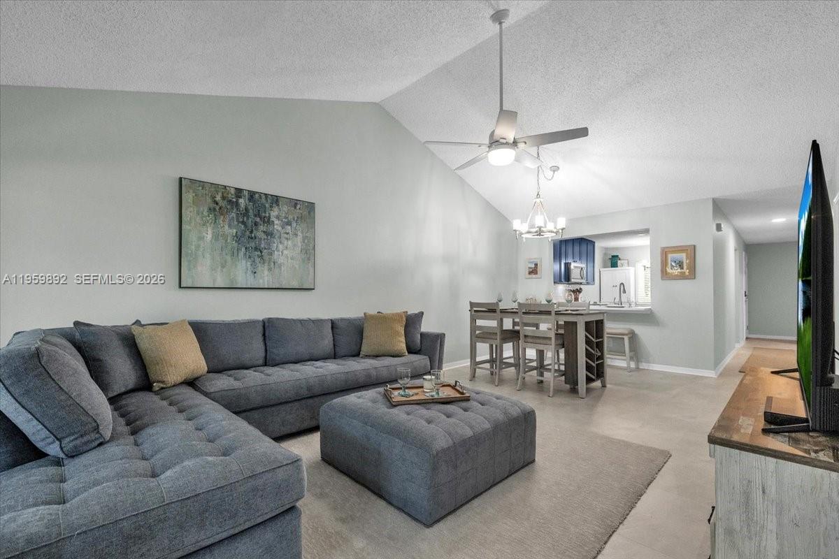 LOCATION, LOCATION, LOCATION… Escape to your very own AFFORDABLE BEACH TREAT, LESS THEN 4 MILES TO THE BEACH or BIKE to the Greenway & Baker Park! This FURNISHED 3 bedroom, 2 bathroom, spacious condo has an UPDATED bright & cheery kitchen w/ stainless steel appliances, quartz countertops, pantry cabinets, pull-out trash cans & custom breakfast table. Entertain w/ ease in your open floor plan plus VAULTED ceilings in the living & dining room.  A NEW sectional that fits the space so beautifully stays w/ the purchase of this home. All living space flooring has been UPDATED LVT w/ P90 underlayment & all bedrooms have NEW luxurious carpet. Enjoy tranquil WATER & FOUNTIAN VIEWS from your screened in lanai...Making this place a perfect winter getaway or full-time residence!!! Timber Lake is a surprise w/ a Club House, Pool & tennis court, this small complex is tucked away but yet in the middle of everything close by! Book your private showing