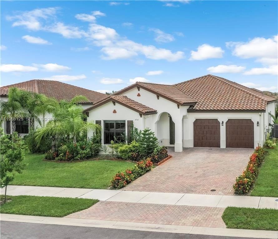 NEW LISTING PRICE! This stunning 4-bedroom, 3-bathroom residence offers 2,466 square feet of elegant living space with impressive 12-foot ceilings, creating a bright and expansive atmosphere throughout. The open-concept layout features a spacious living area seamlessly connected to a gourmet kitchen with granite countertops, ideal for both everyday living and entertaining.
The home boasts tile flooring throughout, generously sized bedrooms, and a luxurious primary suite with a large walk-in closet. Step outside to the oversized covered lanai, perfect for entertaining guests or relaxing while enjoying the peaceful surroundings year-round.
Additional highlights include impact-resistant windows and doors, providing enhanced security and peace of mind.
Located in the prestigious Maple Ridge community in Ave Maria, residents enjoy resort-style amenities such as a clubhouse, swimming pool, basketball, tennis, and volleyball courts, plus much more.
This exceptional property offers the perfect blend of luxury, comfort, and lifestyle. Schedule your private showing today and make this remarkable home yours!