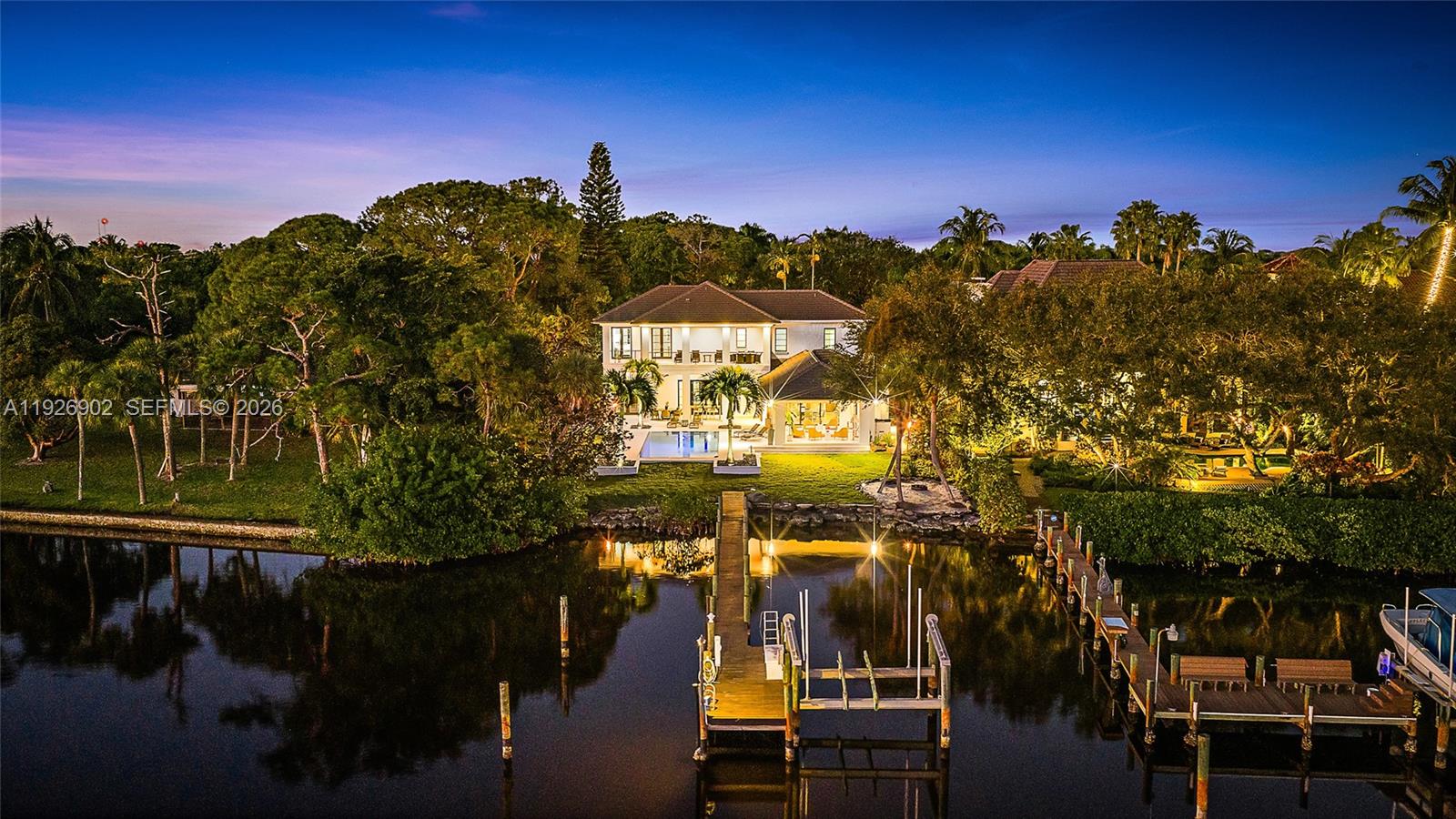 Nestled on nearly one acre of pristine riverfront, this exceptional estate offers breathtaking wide-water views facing south. The main residence features 4 spacious bedrooms, designed to capture natural light and the serene beauty of the river. A charming two-story guest house provides ultimate flexibility, with 2 separate living areas each with a private bedroom, and a full bath—perfect for extended family, visitors, or a private studio. Outdoor living is elevated with a stunning loggia, complete with a fireplace and elegant stone floors, creating the ideal setting for entertaining or quiet evenings overlooking the majestic river. This rare offering combines timeless architecture with unmatched views, delivering a lifestyle of tranquility and sophistication along the water's edge.