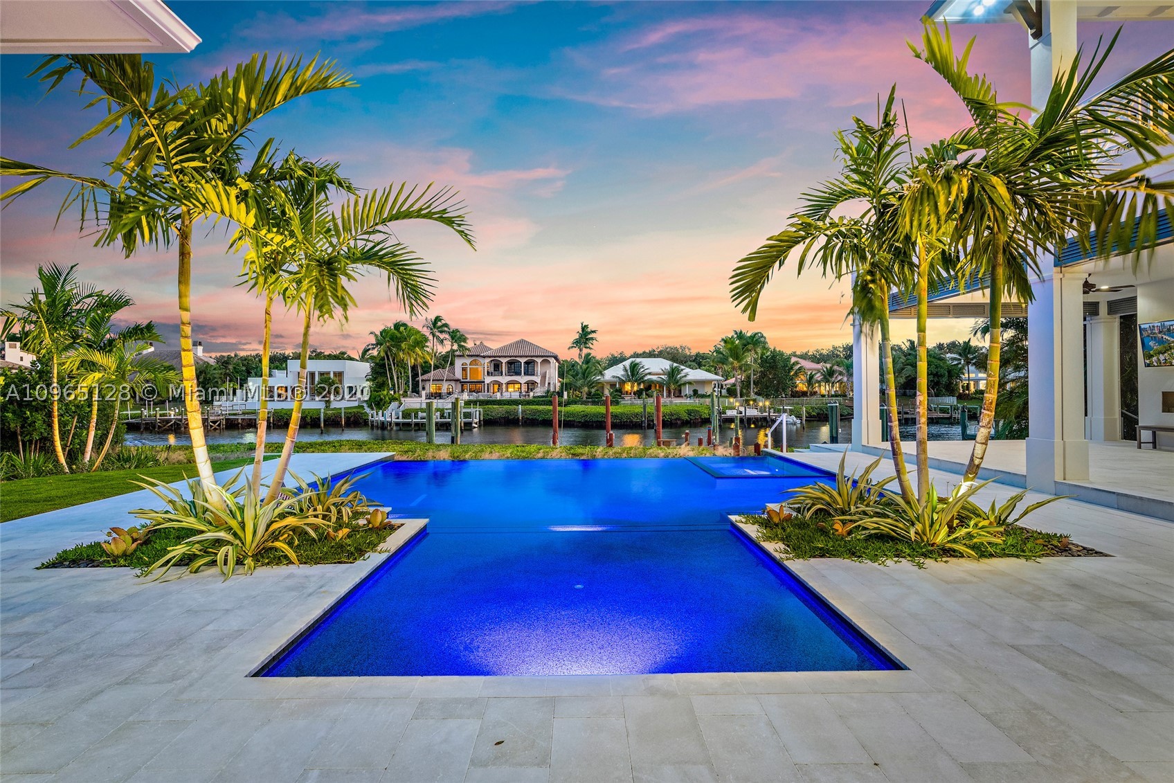 This New Construction Home Located in prestigious Admirals Cove is Ready for you to move right in. The moment you enter, this estate will take your breath away with its sleek and clean finishes. Featuring 4 bedrooms, 5 bathrooms and 1 powder room, club room, fitness room, home theater and 2 laundry rooms. A gourmet-chef's kitchen with Calcutta Porcelain counter tops and the latest high end Sub Zero & Wolf appliances. European Oak wood floors throughout highlighted by an expansive great room with custom fireplace overlooking a resort style pool/spa, an loggia with phantom screens, a full summer kitchen with an outdoor shower and impact glass are just a few of this home special features. Required golf membership purchase conveys all the first class amenities of Admirals Cove.