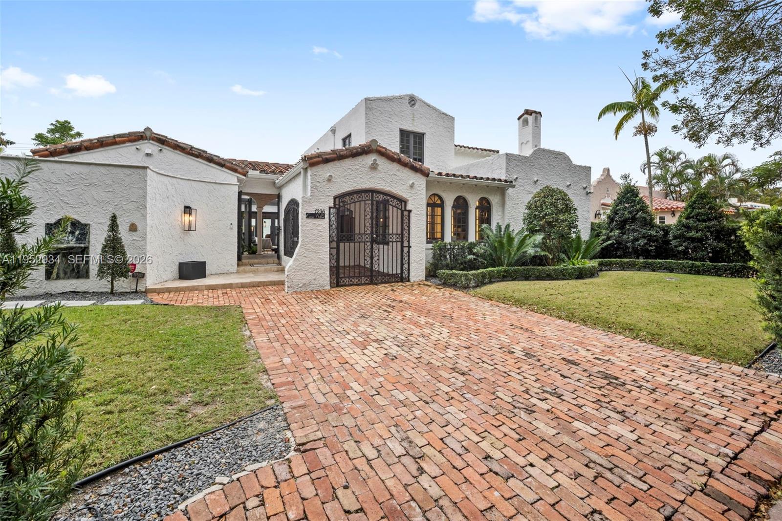 Introducing 1236 Obispo Ave, a luxurious haven nestled in the heart of Coral Gables. This exquisite property boasts 4 bedrooms and 4 bathrooms (3 bedrooms in main home and guest quarters), providing a spacious and comfortable living space for the discerning homeowner. With a dedicated wine room for connoisseurs, working fireplace, heated pool for all season backyard entertainment, this home creates a perfect setting for relaxation and enjoyment and the ideal venue for hosting gatherings. Impact windows and doors offer both elegance and protection. The main bathroom presents a unique outdoor shower, seamlessly blending nature with contemporary design. This residence stands as a testament to meticulous craftsmanship and opulence with the best finishes available.