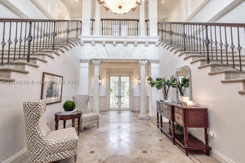Enjoy La Dolce Vita in this Magnificent Italian inspired estate in Stonegate, a prestigious guard-gated enclave in Ponce-Davis. Timeless Mediterranean beauty welcomes one through impressive arched drs & a 2-story elegant foyer w/ double staircase. The classic floor plan frames the central courtyard w/ fountain bringing in natural light. The formal areas feature crown molding, trey & coffered ceilings, wine cellar & 4 fireplaces. Kitchen w/ cooking island & spacious breakfast rm overlook the pool. 3 BR & office downstairs plus 2 half baths. Upstairs there are 3 ensuite BR & private master suite w/ fireplace, separate dressing area & marble bath. An open balcony overlooks the pool & sumptuous tropical 3/4-acre garden. 3-car garage, full house generator. Community tennis court & playground.