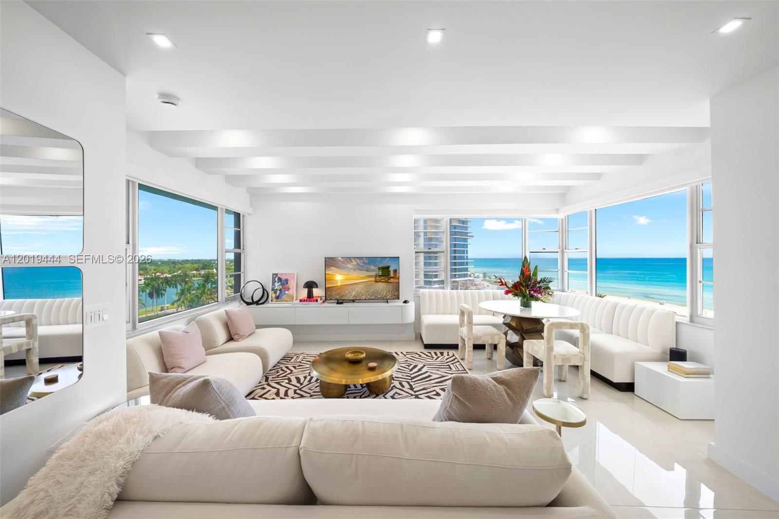 Casual elegance describes this BEACHFRONT pied-à-terre. NEWLY RENOVATED reconfigured 1475SF 2 Bedroom 2 Bath apartment w/stunning DIRECT OCEAN VIEWS. Offered TURNKEY/FURNISHED less certain art. Simply bring your clothes & toothbrush. Rarely available this 8th floor highly desirable F-line apartment is located in ICONIC OCEANFRONT BLDG by reputed architect Melvin Grossman on Millionaire’s Row.
Contemporary finishes include 4x4 white porcelain floors, custom kitchen/bathroom vanities, picture frame molding wall accents, hurricane impact windows. Neutral furniture tones perfectly complement the apartment’s oceanfront panorama. Primary bedroom has oversized walk-in closet. Electric roll down shades throughout. Pet friendly bldg, 24hr concierge, valet, Fernando Wong designed pool deck, fitness center, private beach access with complimentary beach valet service. Assigned storage on floor & 1 assigned garage parking space.. MAINTENANCE INCLUDES ALL UTILITIES. Minutes to Design District, Bal Harbour, South Beach.