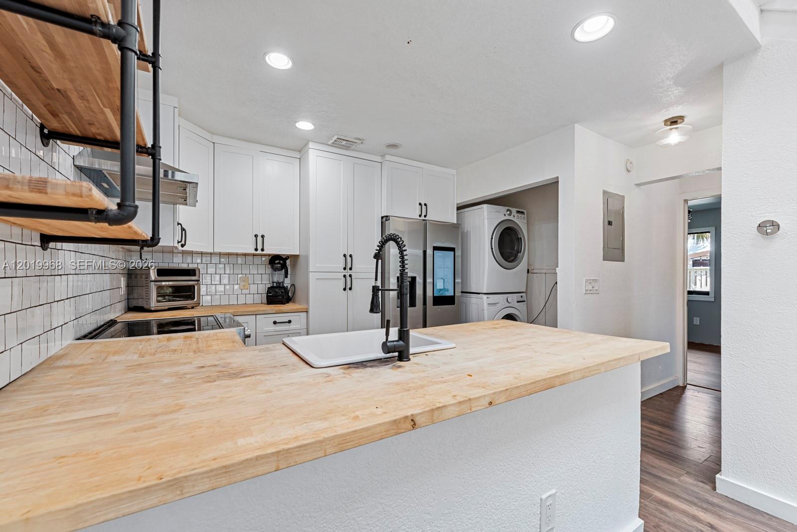 Spacious opportunity in the Players Place community! . This two-level townhouse offers exceptional space and flexibility for both first-time homebuyers and savvy investors. This move-in ready home offers the ideal combination of comfort, value, and convenience. This rarely available corner unit features the largest floor plan in the community with added privacy, extra windows, and an open feel throughout. Enjoy a bright and spacious 2 bedrooms and a full bathroom downstairs, an oversized primary suite upstairs, with high vaulted ceilings kissing the sky, plenty of natural light, an inviting living area, and a functional kitchen perfect for everyday living and entertaining. The private outdoor space is ideal for relaxing, family gatherings, or weekend BBQs. Conveniently located near schools, parks, shopping, dining, and major highways, this home makes commuting easy while keeping you close to the beach and everything South Florida has to offer. Whether you’re looking to stop renting and start building equity or savvy investors seeking strong rental potential, opportunities like this don’t come around often — spacious floor plan, corner location, and room to grow all in one! FHA, VA Buyers welcome. There is an FHA assumable mortgage with 3% interest rate! Down payment assistance may be available for buyers that qualify.