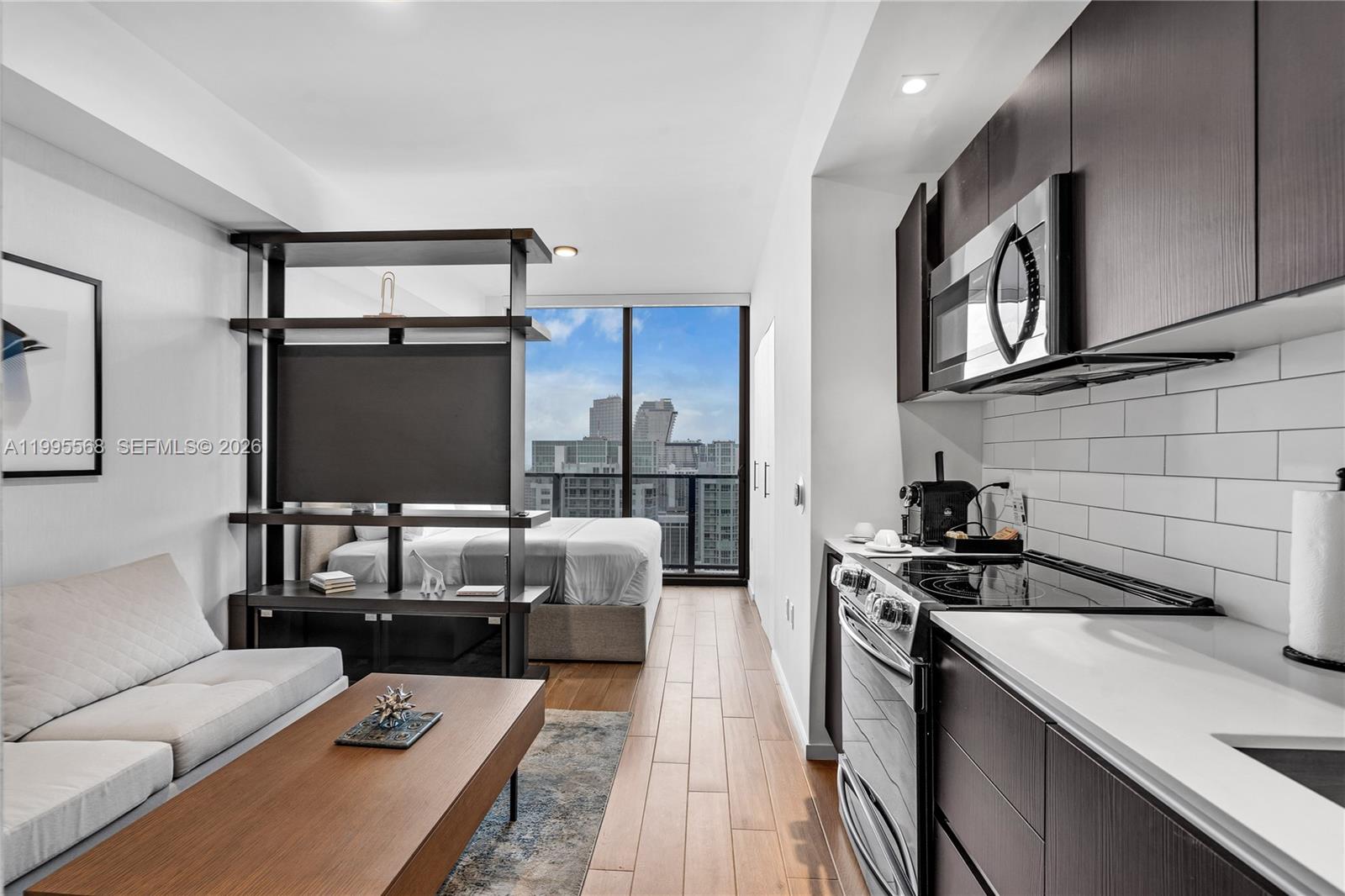 Experience elevated luxury living at The Elser Hotel & Residences in Downtown Miami with this stunning high-floor studio on the 47th level, offering breathtaking panoramic views of the Miami skyline and Biscayne Bay. This fully furnished residence features high ceilings, floor-to-ceiling windows, and designer finishes throughout, creating a modern and sophisticated living experience.

The sleek kitchen is equipped with premium cabinetry and top-of-the-line appliances, ideal for both everyday living and short-term rental income. Residents enjoy world-class amenities including resort-style pool, fitness center, concierge services, and an exclusive on-site Michelin-starred dining experience.

Located in the heart of Downtown Miami, just minutes from Brickell City Centre, Bayside Marketplace, museums, parks, and major highways. Only a short drive to South Beach and Key Biscayne.

Ideal for investors, this property allows daily rentals, making it a prime opportunity for Airbnb or short-term income in one of Miami’s fastest-growing luxury markets.