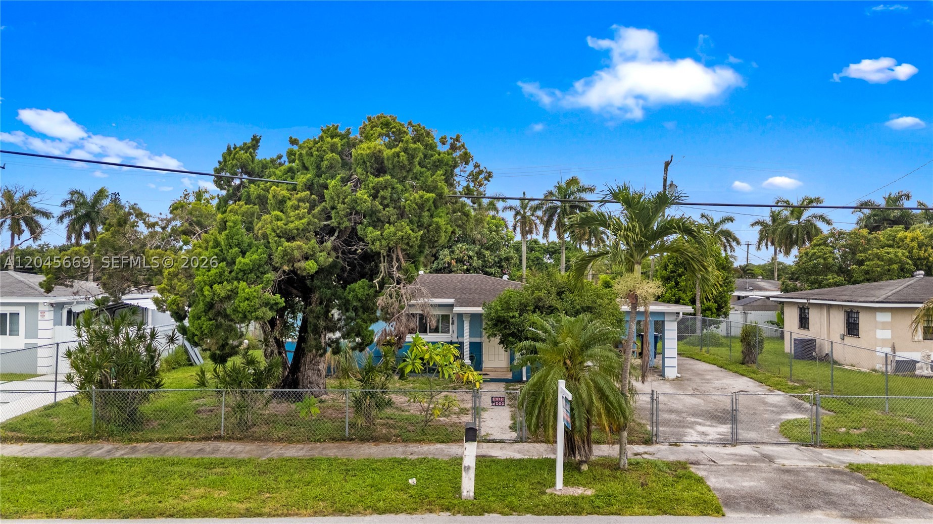 Perfect Home ready for a new owner Centrally located, close to highways, shopping, and Entertainment. This home is a three bedroom and one and a half bathroom. Roof was done in 2016 and has all hurricane impact windows and doors. Property is completely fenced in and has a large driveway and a carport. Backyard is spacious and interior floors are Terrazzo.