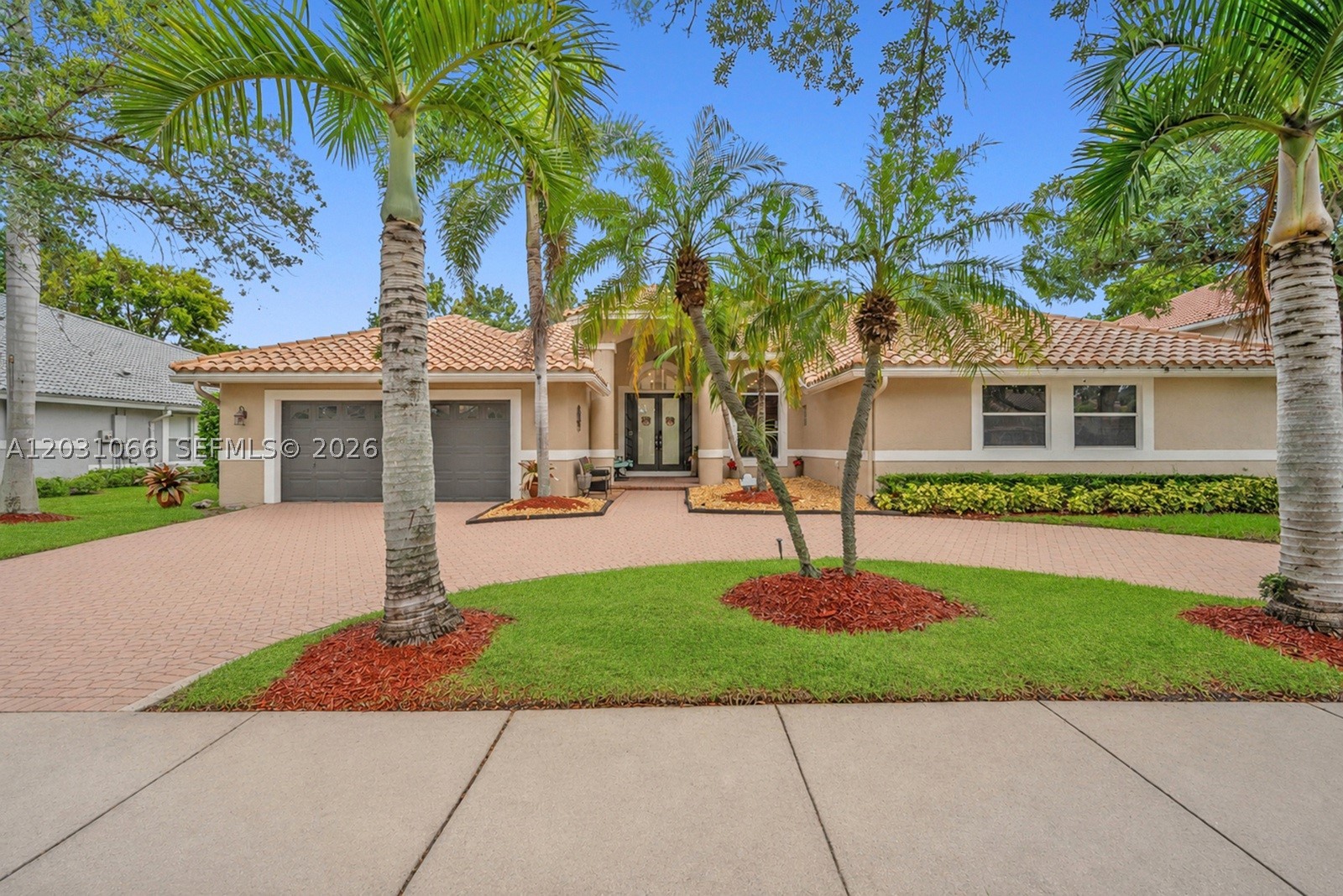 This spacious 5 bedroom, 4 bathroom home is located within the desirable gated community of Eagle Trace in Coral Springs. A circular driveway welcomes you home and provides ample parking. Featuring high ceilings and a bright, open layout, with plenty of room for everyday living and entertaining. The living areas showcase marble style metallic epoxy flooring, creating a distinctive and elegant look throughout the main spaces. Fresh interior paint, updated window treatments, and LED lighting add a modern touch. The renovated primary bathroom features dual operating showers that leaves you feeling like you were at a spa. A guest bedroom with a full ensuite bathroom provides comfort and privacy for family or visitors. An entertainment or flex space with a built in bar has endless possibilities for hosting guests, creating a game room, home theater, or additional living area. Step outside to enjoy the gas heated pool and hot tub, both resurfaced in 2021, creating the perfect setting for daily enjoyment. Additional features include central vacuum and a functional floor plan designed to accommodate a variety of lifestyles. Eagle Trace is known for its exceptional amenities, all while being conveniently located near shopping, dining, parks, and major roadways. This is an excellent opportunity to enjoy spacious living in one of Coral Springs' most sought after gated communities and top rated school districts.