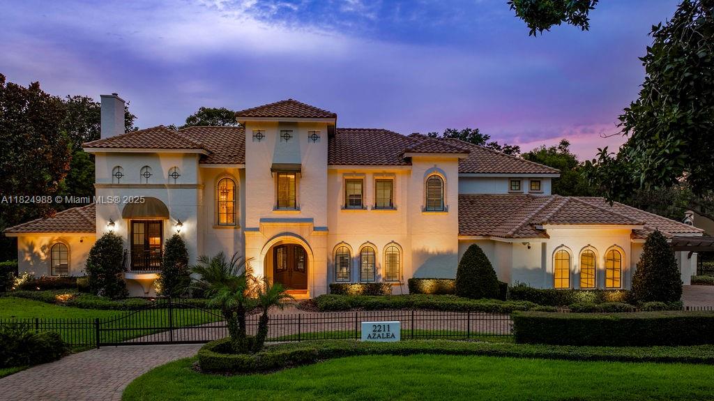 Luxurious waterfront estate in one of Winter Park’s most prestigious neighborhoods, offering 7,278 SF of elegant living with direct canal access to Lake Maitland. This 5-bedroom, 6.5-bath home features all en-suite bedrooms, including two on the main floor, a gourmet kitchen with Viking appliances, three fireplaces, a theater room, a game room, an office, dual laundry rooms, and dual staircases. Enjoy a heated saltwater pool and spa, summer kitchen, and pool bath. Boathouse, dock with lift, and jet ski dock included. Recent upgrades: all new AC units, pool equipment, landscaping, fencing, and gates. Fully fenced with a security system and a rare 5-car garage, this property offers privacy, space, and luxury at every turn.