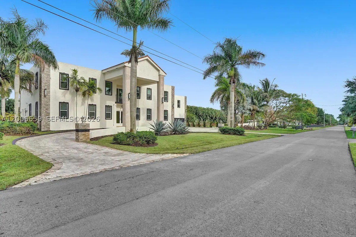 Big homes are common—this one is on another level. Located in the highly sought-after Plantation Acres, this estate delivers true scale, privacy, and presence—something increasingly rare in today’s market.
Spanning over 8,000 sq ft, this 9-bedroom, 6-bath residence is defined by soaring ceilings, massive living spaces, and an incredible sense of openness throughout. Every room feels oversized, from the expansive main living areas to the generously sized bedrooms—ideal for large families, multi-generational living, or hosting on a grand scale.
At the heart of the home is a chef’s kitchen that seamlessly connects to multiple gathering areas, making entertaining effortless. A dedicated home theater and an expansive game room elevate the experience, creating a true in-home entertainment hub.
Set on a huge lot with a massive driveway and oversized garage, the property offers both privacy and functionality—perfect for multiple vehicles, guests, or simply enjoying the wide-open space that Plantation Acres is known for.
The backyard is your private retreat, complete with a pool and endless room to expand, entertain, or design a resort-style outdoor oasis. The scale of the lot provides flexibility that’s rarely available.
Beyond the home, Plantation Acres is one of Broward County’s most desirable communities—known for its quiet, estate-style living, spacious properties, and access to top-rated schools.