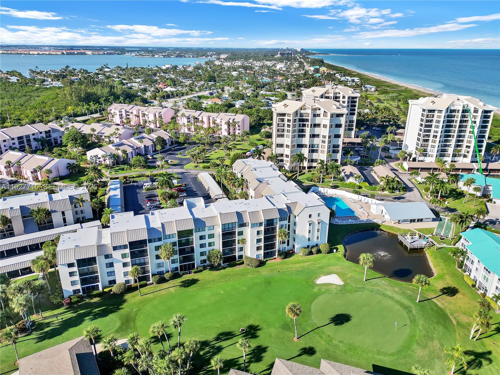 Paradise Found! Don’t miss this opportunity to own a beautifully updated corner-unit condo in the oceanfront Ocean Village community featuring new waterproof vinyl flooring throughout and a new washer and dryer. Ideally located near the newly remodeled pool. Steps from the BBQ area, outside storage unit and 1 covered parking space, plenty of visitor parking. this unit backs directly onto the 7th hole of the executive golf course, offering peaceful green views and added privacy. Ocean Village is an award-winning, gated oceanfront community with 24-hour security and resort-style amenities including heated pools, pickleball and tennis courts, bocce ball, shuffleboard, fitness center, tiki bar, oceanfront restaurant, an executive 9-hole par-3 golf course, and 3,000 feet of pristine beach. Located on South Hutchinson Island, this residence is perfect as a primary home, vacation getaway, or investment property—experience the ultimate coastal lifestyle.Monthly Fee ($1368.00 HOA Monthly / $893 POA Quarterly).
