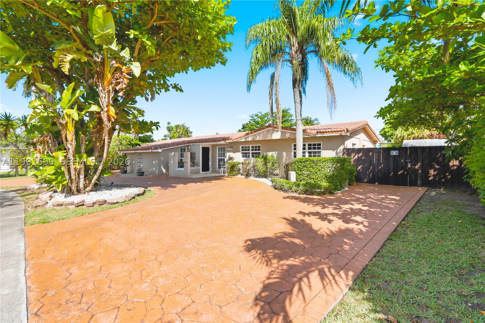 This spacious 5-bedroom, 3-bathroom residence set on an expansive ~0.4-acre lot, offering exceptional space, privacy, and comfort. A 1,250 SF addition (2008) introduces a private primary suite complete with its own A/C, spa-like bath, walk-in closet, garage, and additional storage. Interior finishes include porcelain flooring (2015) and a fully renovated bathroom (2024), complemented by multiple living and dining areas designed for both everyday living and elegant entertaining. Three terraces—including a spacious covered terrace updated in 2021—enhance the home’s indoor-outdoor lifestyle. The oversized backyard serves as a private retreat, featuring a resurfaced pool (2025), lush grounds, and two well-maintained sheds. Additional highlights include two primary suites, an oversized walk-in closet, and a side-entry garage. Nestled in a quiet, peaceful setting, this property offers the perfect balance of privacy and convenience.