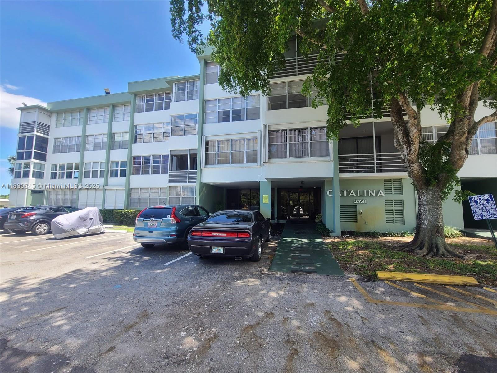 Spacious condo with natural light located in a peaceful community. This home features a large living and dining area, a generously sized bedroom with a walk-in closet. The enclosed balcony has been seamlessly incorporated into the living space, making it ideal for a home office or an additional guest room. Conveniently located just minutes from the I-95, beaches, Fort Lauderdale Airport, shopping centers, and Hollywood’s dining district.