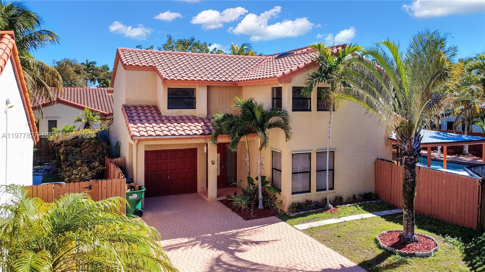 This spacious corner home in the desirable Hammocks area offers a functional and comfortable layout ideal for modern living. The property features one full bedroom and bathroom on the first floor, providing convenience for guests or multi-generational living. Upstairs, you will find a large loft area that can easily be used as a home office, playroom, or additional living space, along with a generously sized primary bedroom. The home offers tile flooring on the first floor and carpet upstairs for added comfort. The remodeled kitchen provides a modern touch, while the private pool and corner lot create an excellent setting for relaxing or entertaining. Located in a great neighborhood within the Hammocks community, this home combines space, convenience, and a desirable location.