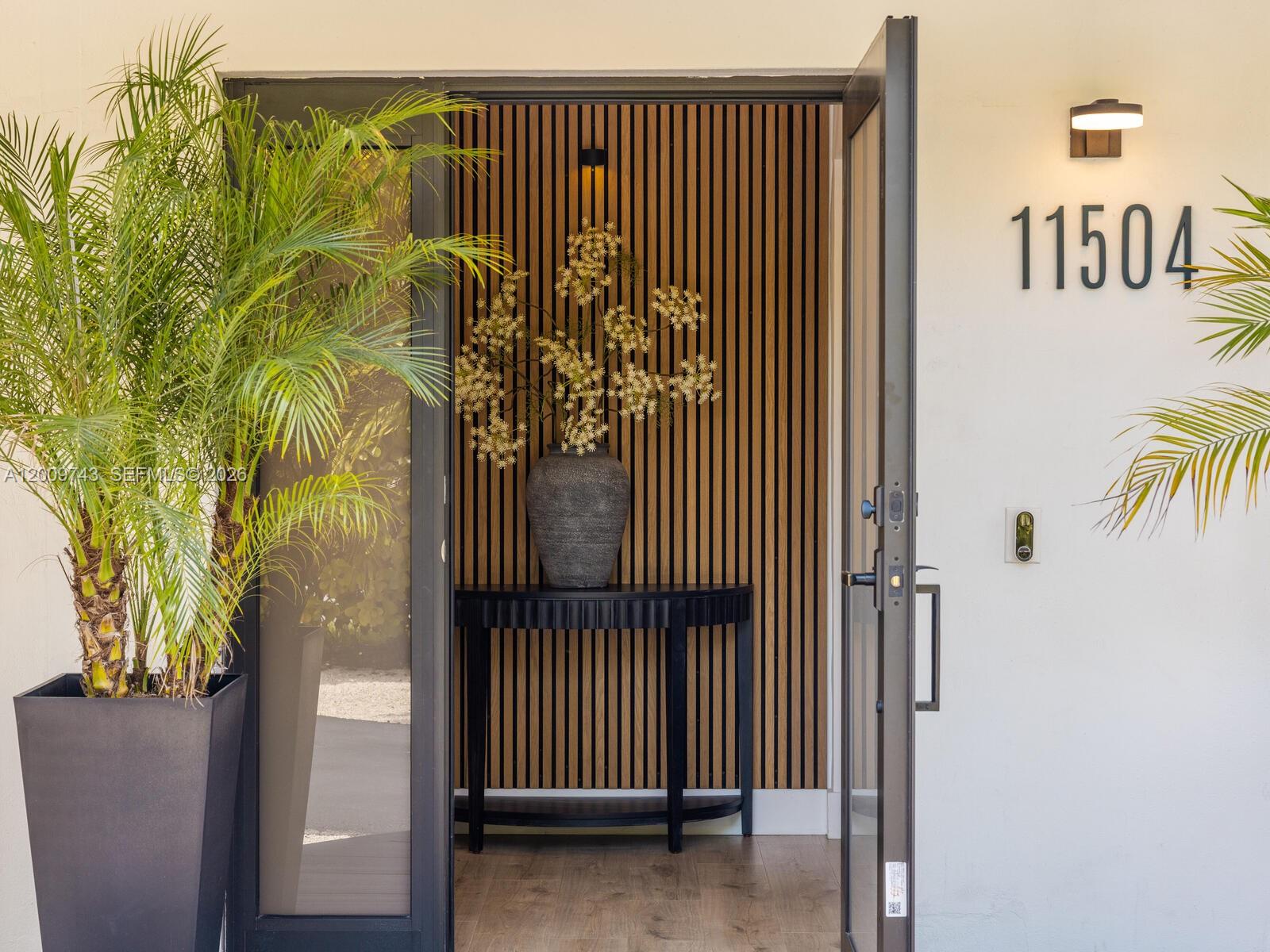 Tucked away behind a stately privacy hedge is Biscayne Park’s best kept secret— a just-renovated midcentury pool home retreat, dripping in high-end, luxe modern design. Welcome to Silver Palms! Enjoy fantastic resort-style living, complete with: open-flow living and dining; bright new eat-in quartzite waterfall kitchen with coffee station and high-end appliances; wide plank light oak wood floors; two double en-suite primary bedrooms; new modern designer baths; custom wood-slat paneling details; updated electrical, lighting, water heater, impact windows-doors; and premier tropical rear gardens with 30’x15' chilled-heated lap pool, Trex and porcelain decks, premium turf grass, and a beautiful screened-in porch. All with a spacious conversion-ready two-car garage and plenty of guest parking.