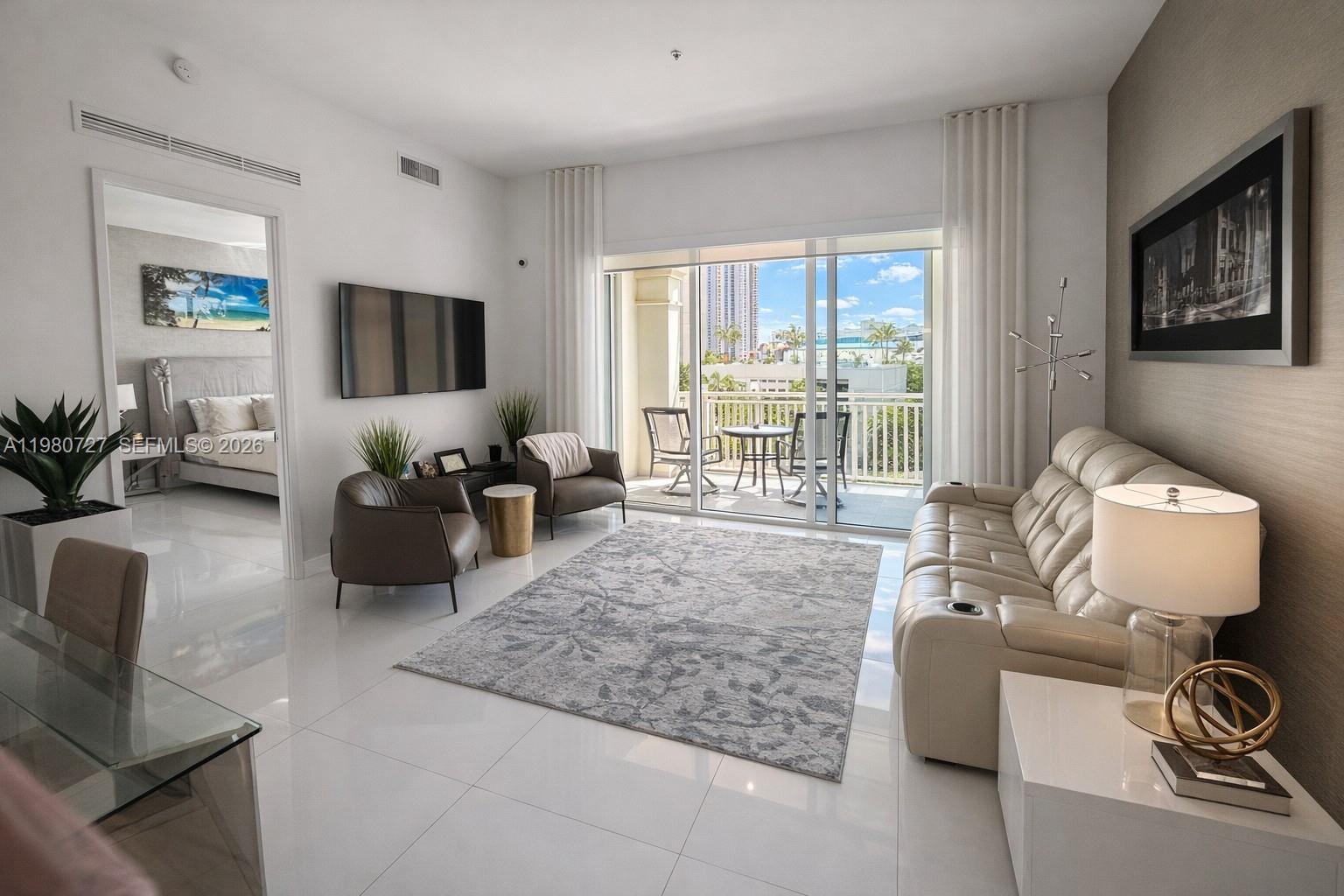 Rare waterfront townhouse-style residence with three bedrooms at St. Tropez in the heart of Sunny Isles Beach. Welcome to TH407, a spacious home offering the comfort of private living with the convenience of luxury condominium amenities.
The residence features soaring 11+ foot ceilings that create a bright and airy living environment, complemented by generous living and dining spaces designed for both comfortable everyday living and entertaining. This level offers just three residences on the floor, providing an added sense of privacy and exclusivity. The home also includes a dedicated laundry room, a feature rarely found in condominium living. Two parking spaces are included on the same floor as the residence—one self-park space and one valet space.
The residence may be offered fully furnished, presenting a true turnkey opportunity—simply bring your personal belongings and settle right in.
Residents of St. Tropez enjoy resort-style amenities including concierge, valet, fitness center, pool, and exclusive private beach club access, all just moments from the ocean, parks, restaurants, and world-class shopping.