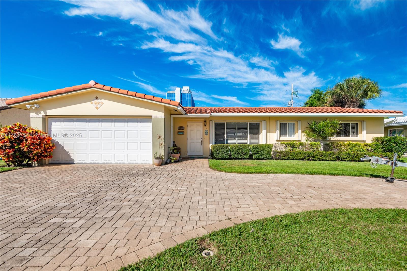 Discover this charming home located in a pocket neighborhood in East Pompano. The property features an open floor plan with sliding doors leading to a spacious screened-in porch, ideal for entertaining. Uniform flooring throughout the main areas. Windows have plantation shutters, and electric blinds. The well-appointed kitchen includes an island, suitable for casual dining or hosting guests. The fully fenced backyard offers privacy and security. This residence enjoys a prime location, within walking distance of grocery stores, shopping centers, and an intracoastal park. It is situated just 2 miles from two popular beach destinations: Pompano Beach and Lauderdale By the Sea. Do not miss the opportunity to reside in this exceptional home in a sought-after East Pompano Beach location.