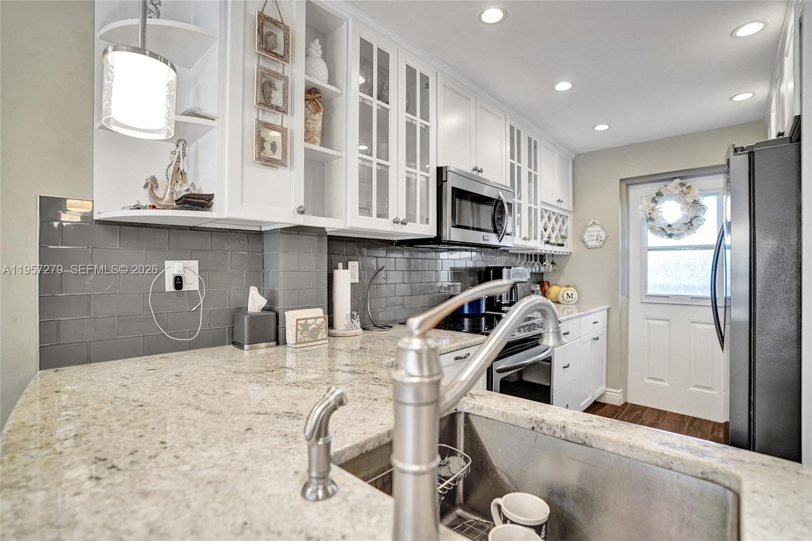 Experience refined coastal living in this beautifully 2-bedroom, 2-bathroom residence offering 1,225 sq ft of thoughtfully designed space. This elegant condo is less than a mile from the beach, just an easy under-20-minute stroll to pristine sand and ocean breezes. Featuring a spacious, open layout filled with natural light and a sophisticated coastal ambiance. Generously sized bedrooms provide comfort and privacy, while the convenience of an in-unit washer and dryer enhances everyday living. Ideal as a primary residence or upscale beach retreat, this home is perfectly positioned near premier dining, shopping, and entertainment in the heart of Deerfield Beach.
