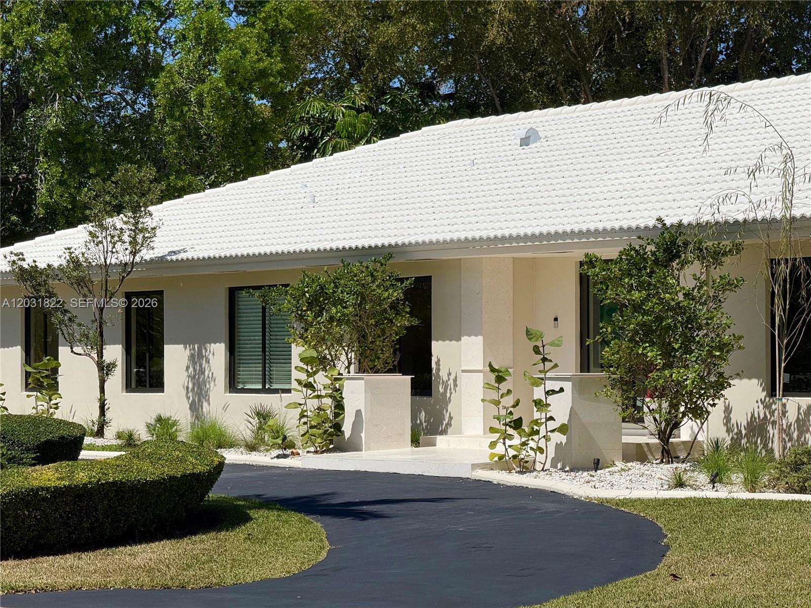 Meticulously renovated split plan Palmetto Bay home by husband and wife architectural design team. Reimagined for modern living with open kitchen featuring marble 16' marble kitchen island that seats up to 7. Home features include impact windows and doors, 3 car garage, engineered oak wood floors, shell stone tile, large open kitchen concept with new SS appliances and volume ceilings, all PVC plumbing, new ACs, and beautiful open redesigned pool area. Dining room could possibly be used as an office also. This home is a split plan layout with 3/2 on one side and a 1/1 on the other. New beautiful landscaping in both the front and back yard for your enjoyment under the covered patio. Main space of the home connects with the outdoors through a series of 3 double doors to bring the outside in.