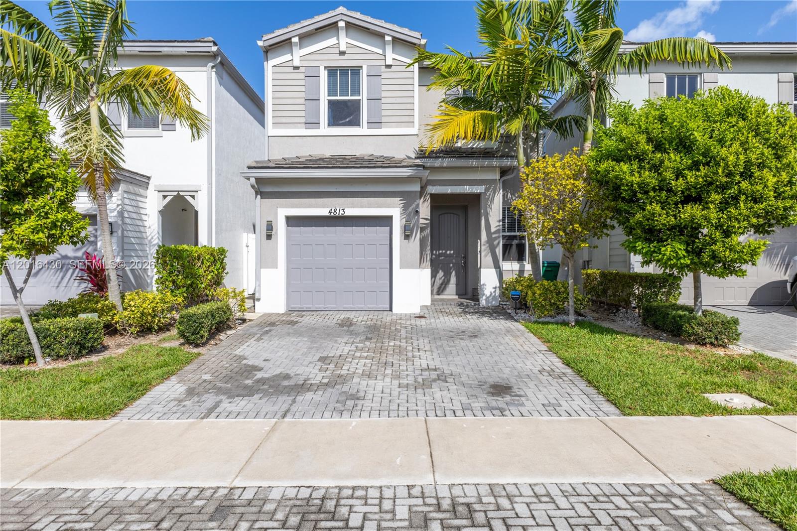 Welcome to this beautifully maintained 3-bedroom, 2.5-bath home in the Hidden Trails community of Tamarac. Featuring a bright and functional layout, this residence offers tile and luxury vinyl plank flooring throughout, including new LVP on the stairs and second floor installed in 2026. The kitchen opens to spacious living and dining areas filled with natural light, while the primary suite provides a private retreat with an en-suite bath. Major updates offer peace of mind, including a 2020 roof, AC, water heater, electrical panel, impact windows and doors, and impact-rated garage door. Enjoy a 1-car garage, additional driveway parking, community pool, walking trails, and playground. Conveniently located near shopping, dining, golf courses, Sawgrass Mills, and major highways.