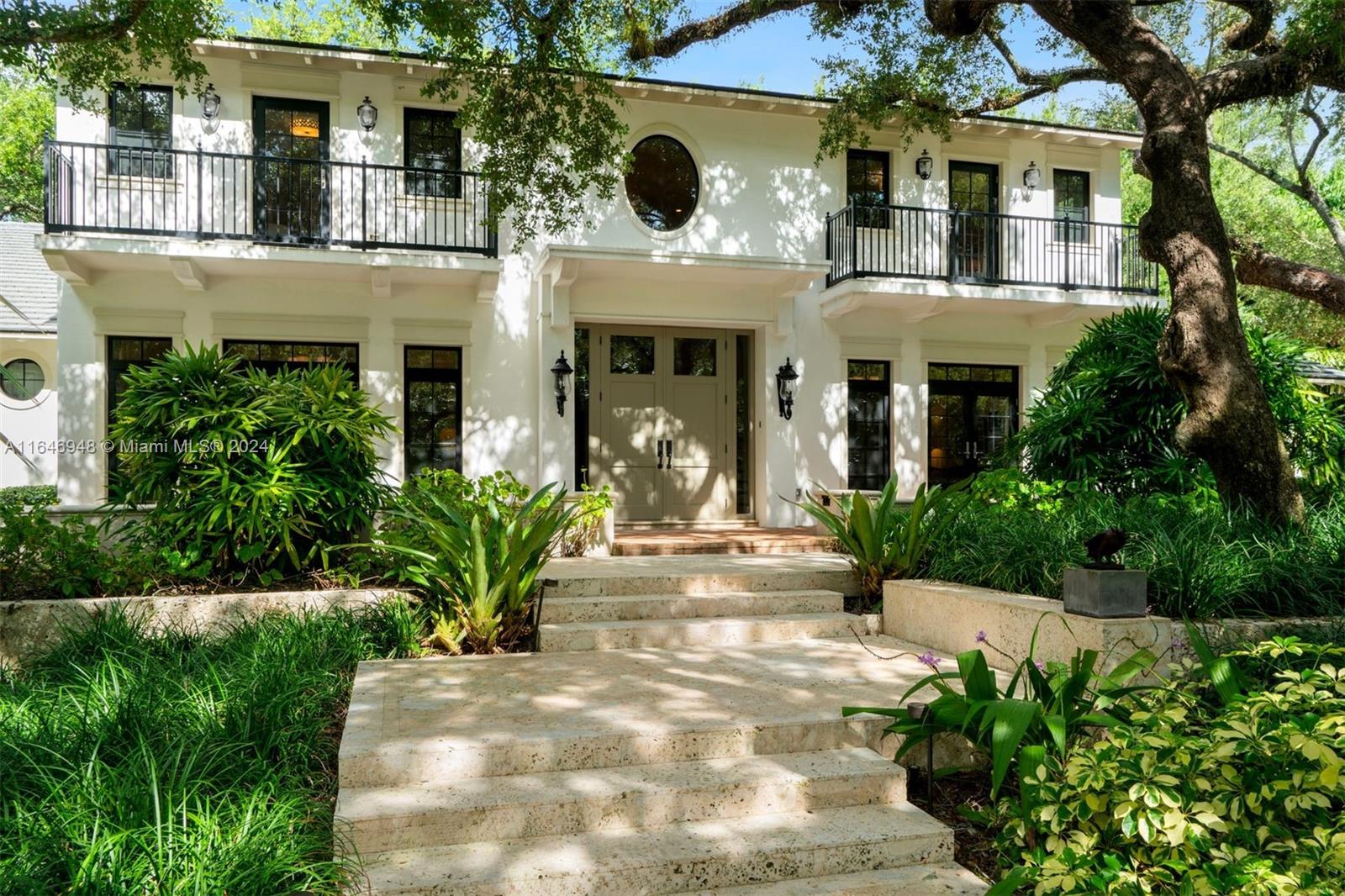 Completely renovated 6,790 SF, 5-BD, 5.5-BA lakefront estate on a 1.5-acre lot in the guard-gated community of Snapper Creek Lakes, with a stunning grand foyer entry, high volume ceilings, and hardwood oak flooring throughout. An open family and dining room offers a two-sided fireplace, coffered ceilings, and wet bar. The eat-in kitchen has Caesarstone quartz countertops, Waterworks fixtures, custom cabinetry, an expansive center island, and luxury appliances. Award-winning outdoor areas, designed by landscape architect Orlando Comas, showcase lush tropical landscaping with mature trees, grotto with fountain, pond, patio with pergola, and a pool. Includes a 2-car garage, impact windows and doors, and new roof.