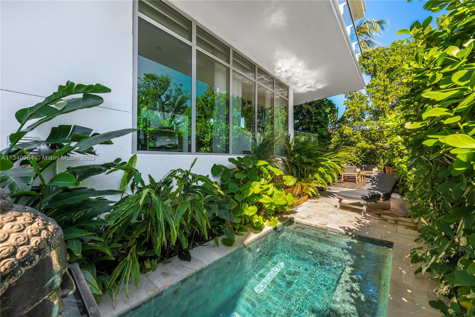 Rare, truly One of a Kind. Waterfront corner, Lanai unit at Sunset Harbour's premier address. A natural 3 bedroom that’s been transformed into a 2 bed but easy to revert. Tax Roll says 1,820 interior SF but measures larger. Architect owned with Duchateau Wood Floors, Italkraft Kitchen, Wolf, and Subzero Appliances. House ‘feel” with a useable covered 425sf Balcony AND step down to your own additional private 1,455 additional SF of beautifully landscaped private yard /garden with a Zen Plunge Pool. Full-service building, Library, Full Gym, 24-hour concierge, and 24-hour Valet.  Best walkable neighborhood in South Beach, Award Winning restaurants, Fitness, and Shopping. Deeded Boat Slip, 30 + feet available valued at $350,000 (NOT in list price), but available.