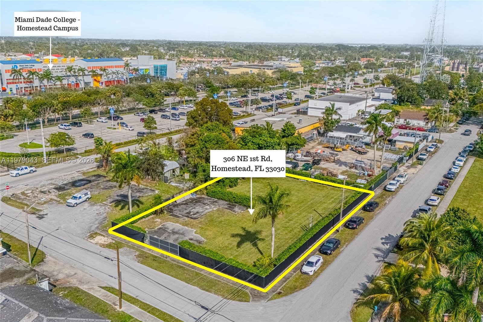 Empty lot with fence and hedge. Zoned B3 (Liberal Business Use)