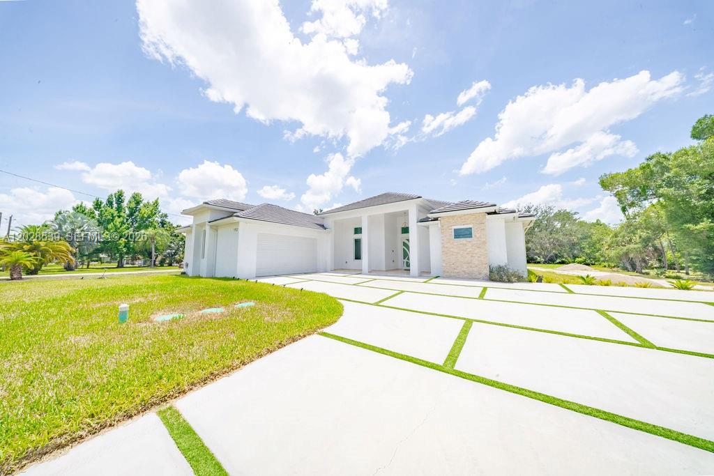 Built in 2025 on 1.14 acres in North Fort Myers, this custom home was designed for comfortable everyday living with quality construction and attention to detail throughout. Offering 4 bedrooms, 3 bathrooms, 2,324 square feet under air, and 3,734 total square feet, the home features high ceilings, abundant natural light, impact windows and doors, premium finishes, an upgraded potable well-water system, and a spacious floor plan that balances functionality with modern design. The outdoor kitchen creates the perfect space for entertaining, weekend gatherings, or simply enjoying Florida living year-round. With over an acre of land, there’s still plenty of room for a pool, detached garage, workshop, RV, boat, or your own backyard oasis. Conveniently located near shopping, dining, and everyday amenities while offering the space and privacy that acreage properties are known for.