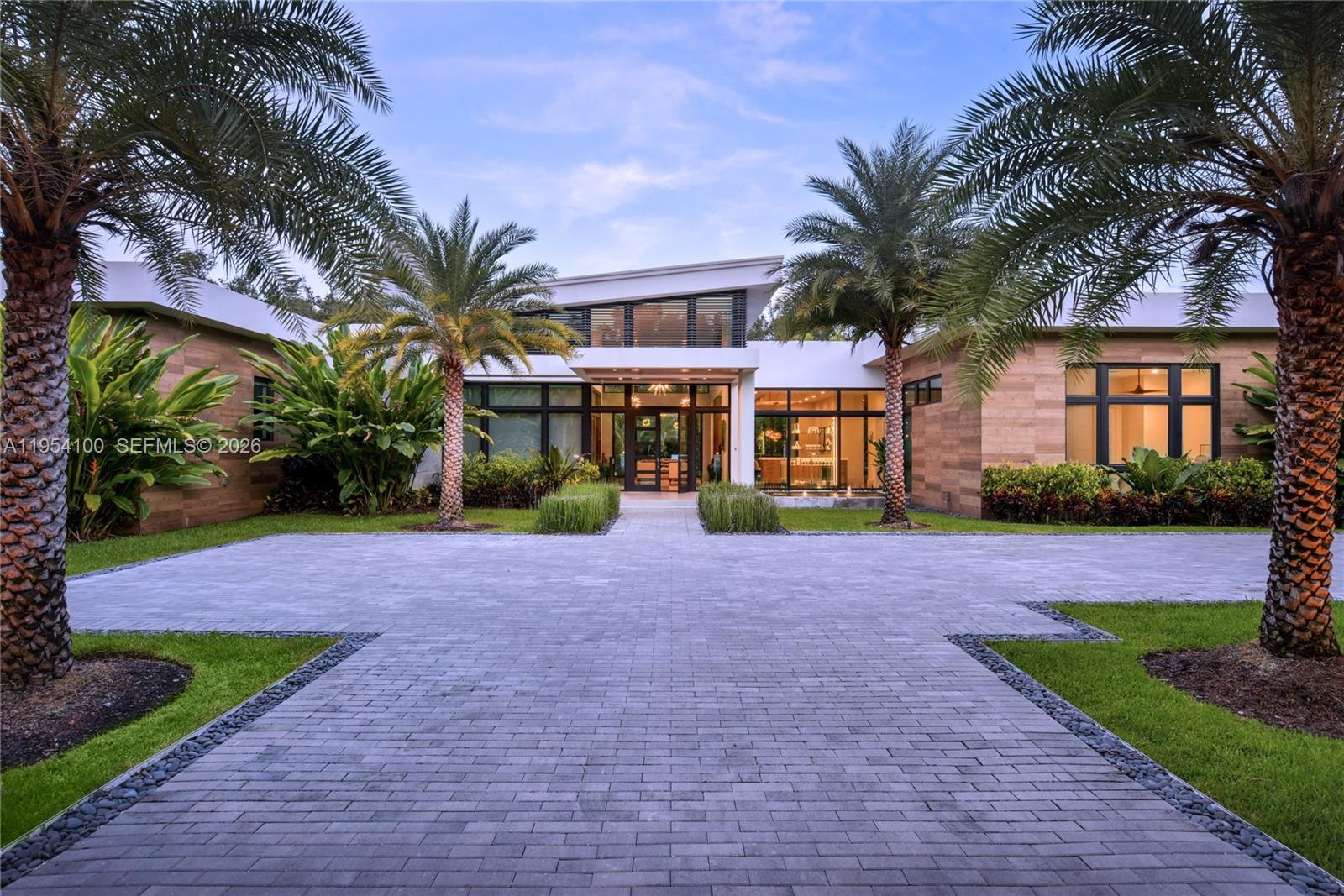 A rare offering combining architectural integrity, modern luxury, and creative functionality !  A 2019 one-story Hollub custom built residence, offering 5 bedrooms and 5 bathrooms on a quiet, beautiful street in North Pinecrest. Thoughtfully designed with clean lines, warm materials, and seamless indoor-outdoor flow, this home is ideal for both everyday living and sophisticated entertaining.
The interiors feature remarkable entertaining spaces, including a showpiece white oak gourmet kitchen, fully built-out private theater, a dedicated study, gym with sauna and  a professional recording studio that can be easily converted into  a 2nd primary or additional beds and baths, offering flexibility for evolving needs. Every space reflects meticulous attention to detail, with top-tier finishes, refined design, and exceptional craftsmanship throughout. Entertain effortlessly with a striking onyx bar, stone fireplace, and club-style lounge, opening to a resort-caliber outdoor setting with lush landscaping and an inviting pool, creating a private oasis perfect for gatherings or quiet relaxation. Smart home with generator!
Designer furniture may be included, offering a truly turnkey opportunity. 
Impossible to replicate today at this price.