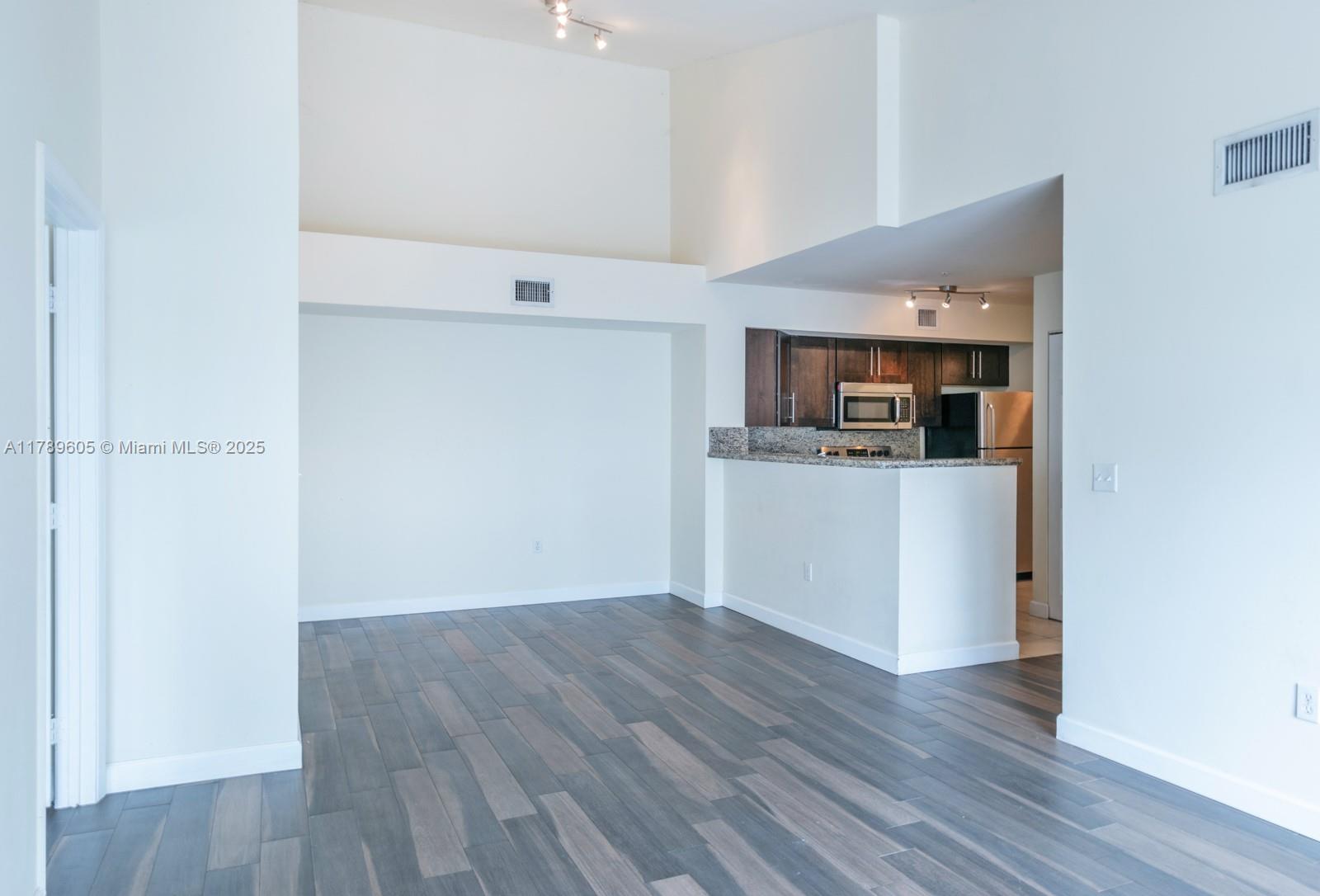 Gorgeous 2 bedroom, 2 bathroom condo in desirable Pembroke Pines! This beautiful home is highly upgraded and features wood-look porcelain tile flooring throughout, fresh paint & high vaulted ceilings. Newer granite kitchen counter tops, wood cabinets & stainless steel appliances complete the kitchen. Enjoy water views from the large balcony or the sparkling community pool is steps away. Also featuring impact sliding glass door, newer A/C, walk-in closets & washer/dryer in home for convenience! Close to highways, shopping, dining and schools!