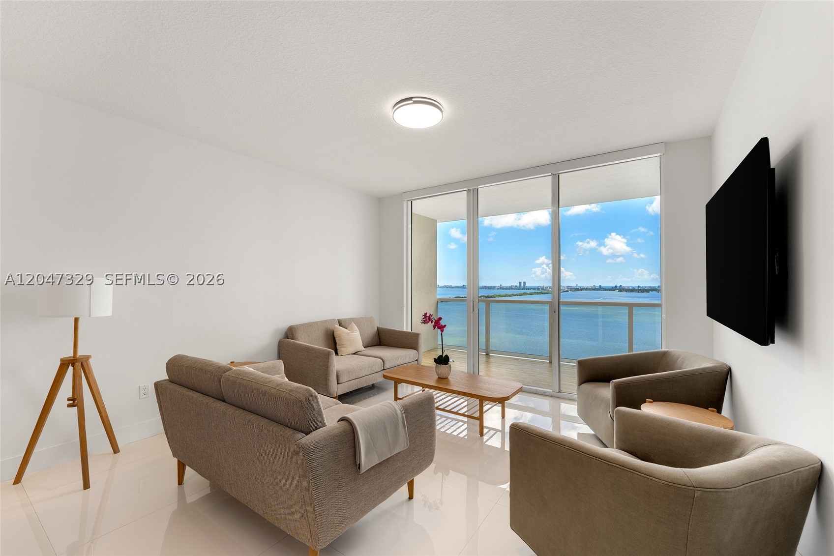 This beautifully appointed 3BR/3BA bayside residence at Bay House in East Edgewater offers 1,432 SF of living space. Freshly and professionally painted, this inviting unit features beautiful 32” x 32” porcelain tile floors throughout & expansive floor-to-ceiling windows provide serene natural lighting. Open dining and living areas showcase direct views of Biscayne Bay & beyond & direct access to a large bay-facing terrace capturing spectacular sunrise views over Biscayne Bay, Miami Beach & the Atlantic Ocean. Sleek chef’s kitchen features custom soft-touch cabinetry, dual sinks, JennAir convection cooktop &  refrigeration, along with eat-in seating. An elegant bay-facing principal bedroom offers direct bay views, terrace access, large walk-in closet w/built-ins & ensuite bathroom with dual sinks & walk-in glass rain shower. Two additional bedrooms located on the west side, each with large windows, sunset city views, walk-in closets w/built-ins & ensuite bathrooms. Laundry room adjacent to the kitchen features a stacked Whirlpool washer/dryer, ventilation & storage spaces. Exceptional building amenities, including a 20,000 SF resort deck with resort-style swimming pool, pool club room, children’s playroom, business center, media room, and state-of-the-art fitness center. Prime location just minutes to Wynwood, the Design District, Downtown, Miami Beach, pristine beaches, fine dining, shopping, parks, galleries, cultural and sporting venues & Miami International Airport.