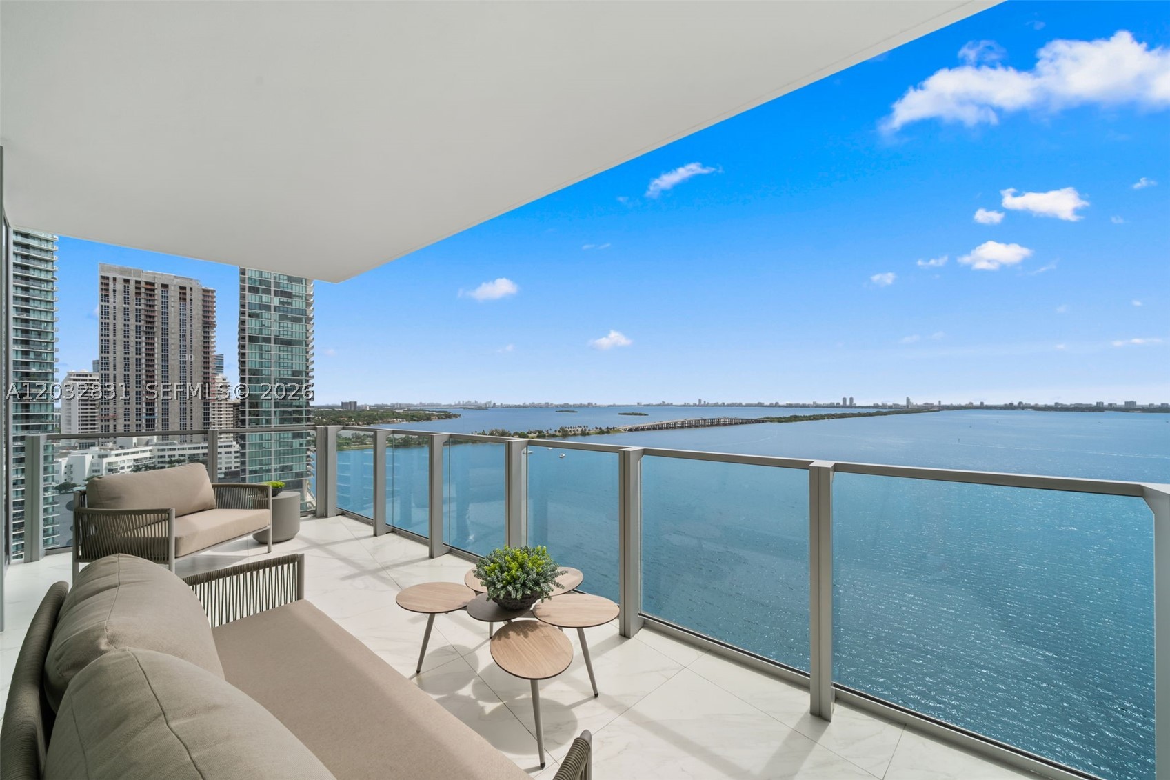 Experience elevated waterfront living at Biscayne Beach in this exceptional corner residence featuring 3 bedrooms + den and 4 full bathrooms. Accessed by a private elevator, the home is surrounded by floor-to-ceiling windows that frame panoramic views of Biscayne Bay and Miami Beach while filling the interiors with natural light.The open-concept layout seamlessly connects the kitchen, equipped with premium Miele appliances, and living areas to the stunning waterfront backdrop. The primary suite serves as a private retreat with beautiful water views, direct terrace access, dual vanities, a custom walk-in closet with built-ins, a separate soaking tub, and a glass-enclosed shower. Each secondary bedroom includes an ensuite bath, while the rear bedroom enjoys its own private balcony. Located in one of Edgewater's premier waterfront buildings, Biscayne Beach offers a refined lifestyle with resort-style amenities including a members-only beach club, pool with private cabanas, state-of-the-art fitness center with spa and steam room, tennis courts, basketball court, dog park, valet service, and more. 2 assigned parking spaces included.