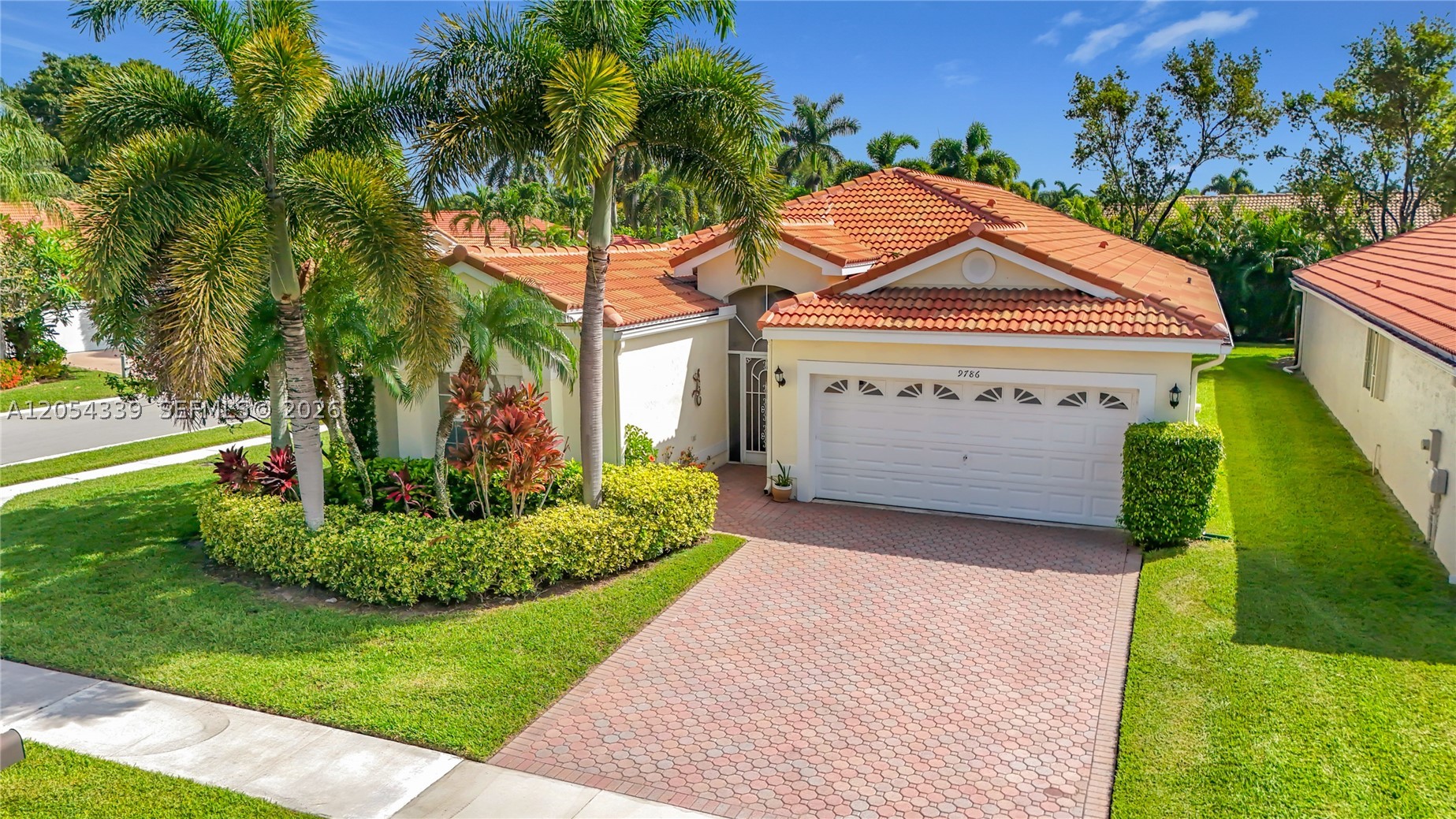 Welcome to The Grove, one of Boynton Beach's premier 55+ active adult communities, where resort-style amenities and a social lifestyle are part of everyday living. Residents enjoy a beautifully renovated clubhouse, resort-style pool and spa, fitness center, tennis and pickleball courts, bocce, shuffleboard, scenic walking paths, and a full calendar of clubs, activities, and social events—all within a gated community conveniently located near shopping, dining, golf, beaches, and major highways.

Offering over 2,100 square feet of living space, this 2-bedroom, 2-bathroom plus den residence features an open floor plan with soaring vaulted ceilings that create a bright, spacious feel throughout the main living areas. Lush landscaping gives a wonderful tropical view from all windows surrounding the home. The generous layout provides comfortable everyday living while offering endless possibilities for customization.

This home has been lovingly maintained and remains largely original, making it an outstanding opportunity for buyers who want to renovate and design a home that reflects their own style. Complete roof installation July 2021.