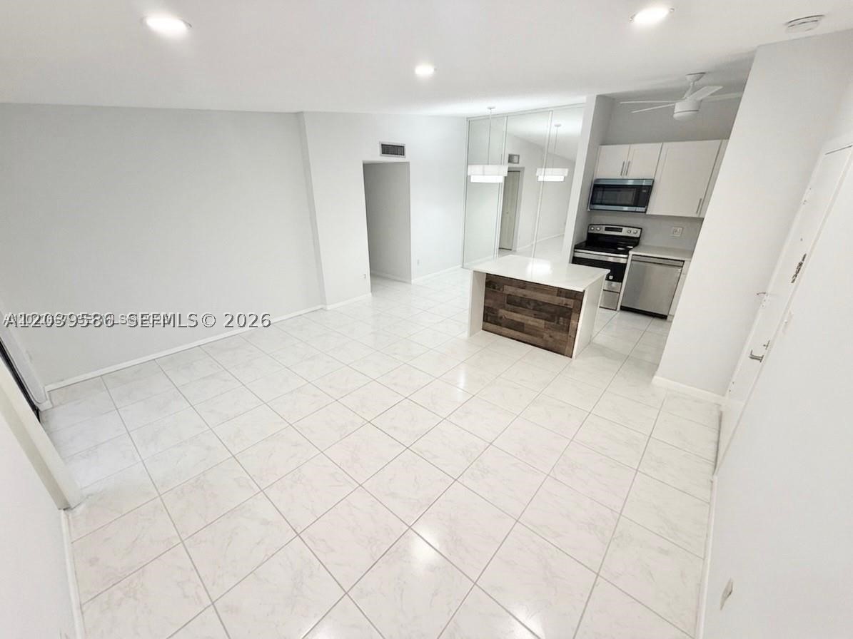 Welcome to this beautifully updated top-floor corner residence in the highly desirable Ashmont at Kings Point community. This spacious 2-bedroom, 1-bath home offers an abundance of natural light, an open and inviting layout, and the comfort of living in one of Tamarac’s most sought-after 55+ communities.

The remodeled interior features elegant flooring, a modern kitchen with upgraded cabinetry and countertops, updated appliances, and a tastefully renovated bathroom. The generously sized bedrooms provide ample closet space, while the enclosed patio offers a peaceful setting to relax and enjoy the South Florida lifestyle.

Conveniently located near the elevator and laundry facilities, this residence combines comfort, functionality, and low-maintenance living. Ashmont residents enjoy access to Kings Point's world-class amenities, including indoor and outdoor pools, clubhouse, fitness center, theater, social activities, courtesy transportation, and countless recreational opportunities.

The monthly association fee includes building insurance, water, internet, cable, reserves, and exterior maintenance, providing exceptional value and peace of mind. Whether you're looking for a year-round residence or a seasonal retreat, this move-in ready home offers the perfect combination of comfort, convenience, and community living.