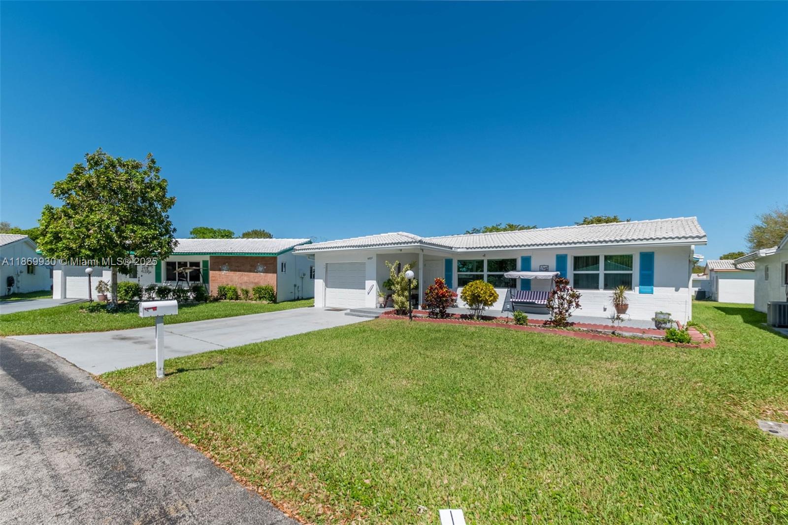 Rare 3 Bedroom and 2 Bathroom Home for Sale in Lauderdale West of Plantation, a 55+ Community! This beautiful, updated home features a bright and open floor plan and elegant ceramic flooring throughout the main living areas and bedrooms. The spacious, upgraded kitchen is equipped with granite countertops, stainless steel appliances, and an inviting eat-in area. Enjoy peace of mind with a newer roof, A/C, water heater, and high-impact windows and doors throughout. Additional highlights include a formal dining area, a double concrete driveway, a lovely patio, and a spacious front porch... perfect for relaxing outdoors. HOA covers roof maintenance, internet, cable TV, a fitness center, saunas, two pools, billiards, and more! Schedule your private tour today!