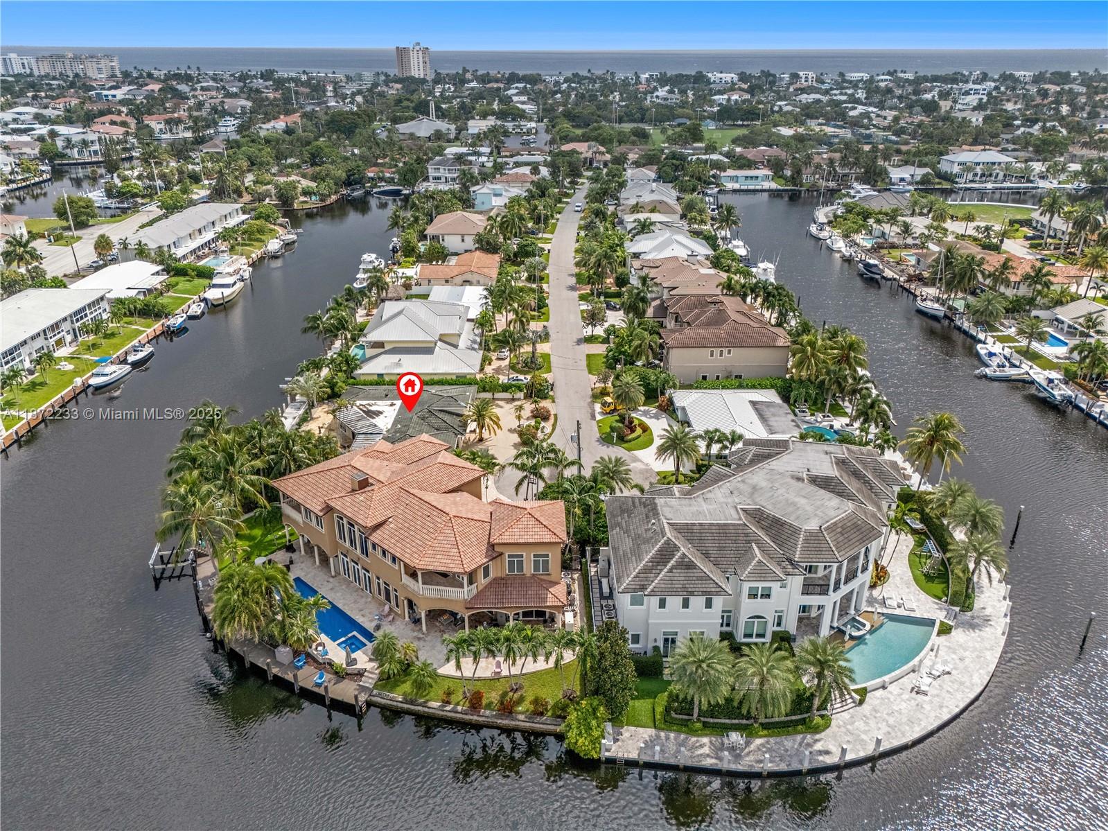 97 Feet Waterfront – No Fixed Bridges – Lighthouse Point Tear-Down
Unmatched opportunity on NE 35th Street: 97 feet of deep-water frontage with no fixed bridges and direct ocean access. Oversized ~9,939 sf lot with existing pool offers the perfect canvas for a luxury two-story custom home (3,500–4,000+ sf). Surrounding sales support new construction values of $3M–$4M+. The existing 1962 residence is sold as-is, land value only. This is a boater’s paradise location with a scarce supply. No contingencies.