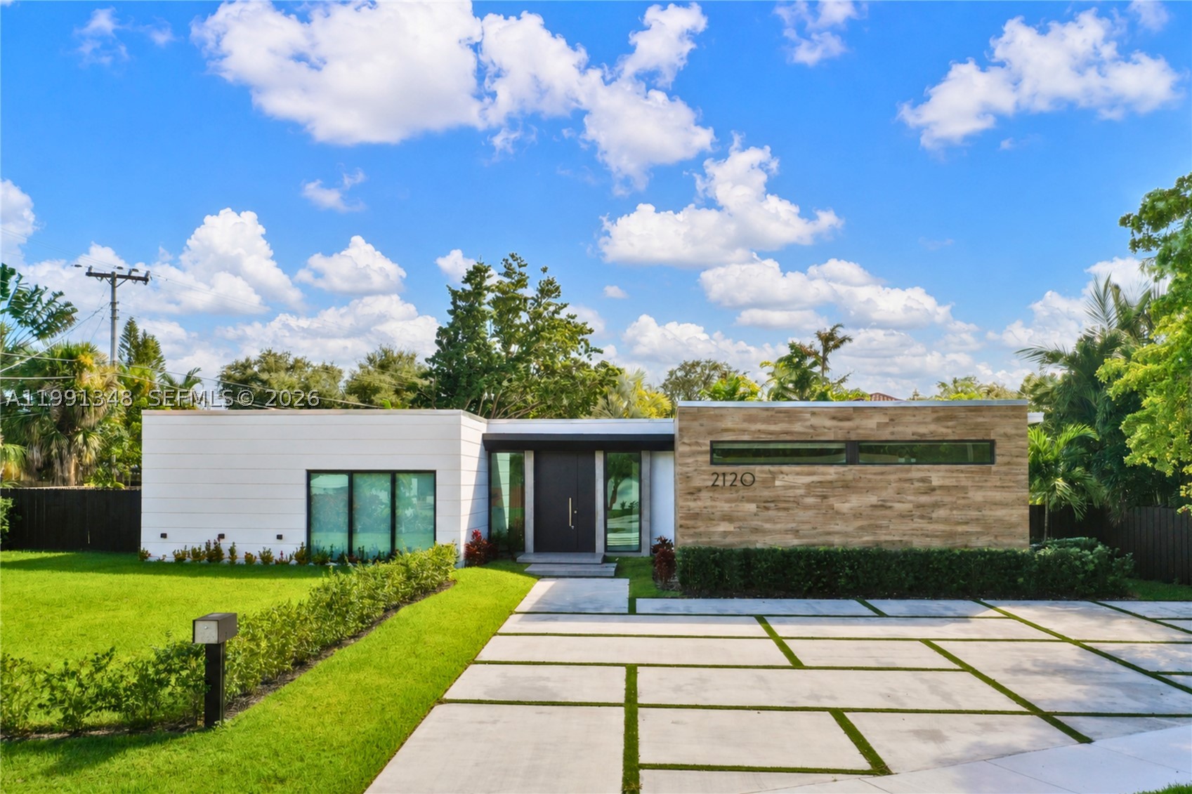 Ultra-modern architectural masterpiece built in 2020 in the Skylake/Aventura area. This stunning gated residence offers 5 en-suite bedrooms, 5 full baths and 2 half baths (powder room & cabana bath), set on a generous 14,455 SF lot.
Spectacular open floorplan with soaring 10-ft ceilings and floor-to-ceiling impact glass doors that flood the home with natural light. PGT impact windows throughout. The showstopping gourmet Veneta Cucine kosher double kitchen features dual Sub-Zero refrigerators, dual wall ovens, dual dishwashers, dual sinks, and gas stovetops, & Espresso Machine —  Wolf & Sub-Zero appliances — built for serious entertaining. Italian porcelain floors, Legrand fixtures, and motorized window treatments elevate every detail. A brand new roof (Dec 2025) with solar panels, Tesla batteries, Tesla car charger installed and storage shed, ensure superior storm resilience and energy independence. Seamless indoor/outdoor living flows to an expansive terrace and resort-style heated pool — the ultimate South Florida lifestyle.
A true turn-key luxury offering in one of Miami-Dade's most desirable neighborhoods.