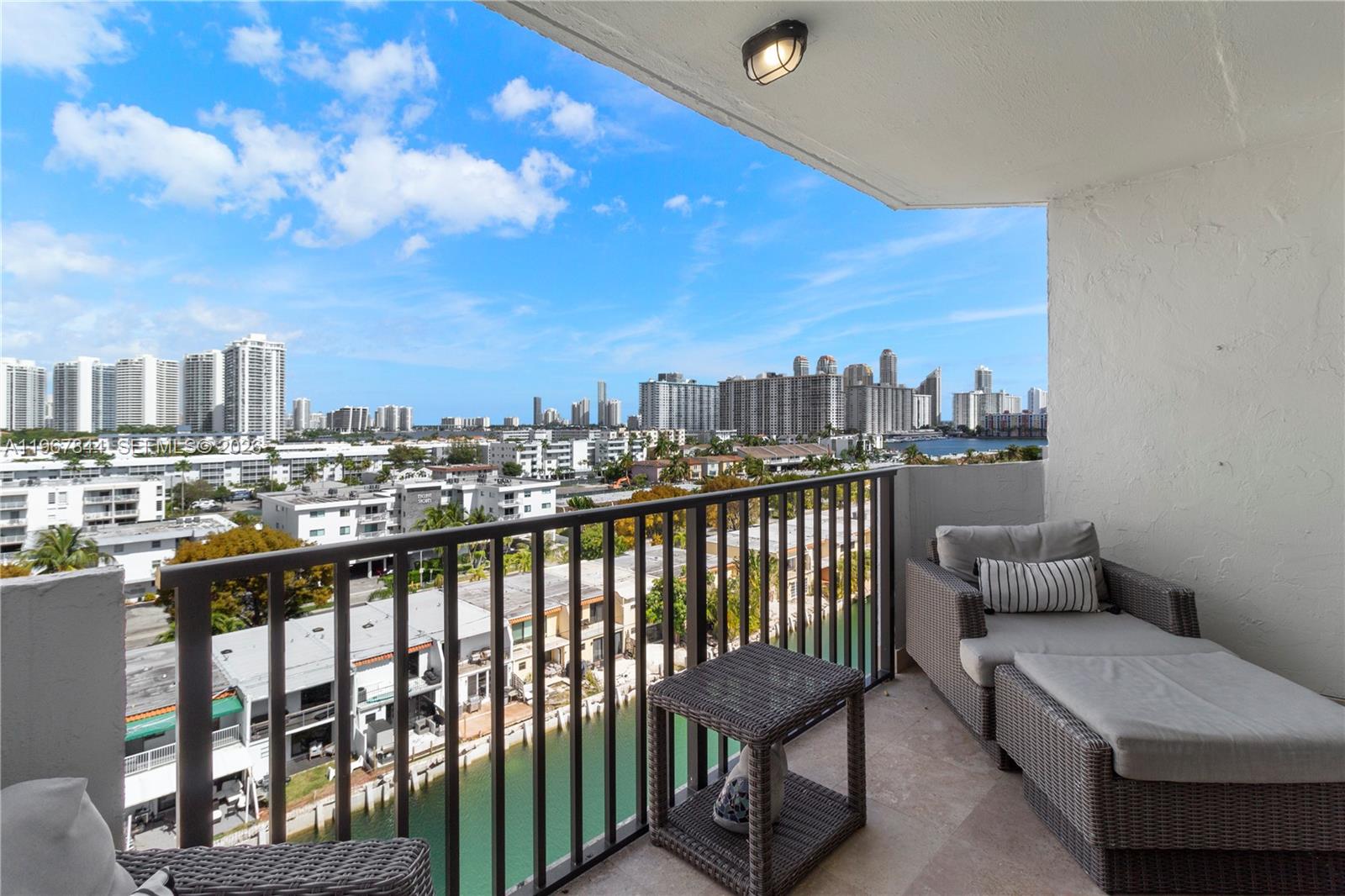 Upgraded 2-bedroom, 2-bath waterfront condo located in the gated community of Eastern Shores. Offering 1,110 square feet of bright and spacious living, this residence features gorgeous water views, laminate tile flooring throughout, beautifully updated bathrooms and open kitchen with bar-style seating. The north-facing exposure allows for comfortable balcony enjoyment throughout the day. Unit includes one assigned covered parking space and a private storage unit conveniently located on the same floor. Residents enjoy a crystal-blue pool and access to marina boat slips available for lease. Must own for one year prior to leasing. The building has passed its 40- and 50-year recertifications and is well managed with strong financials and reserves. Ideally located near shopping, dining, beaches, and major roadways. This unit is ready for its new owner. Easy to show.