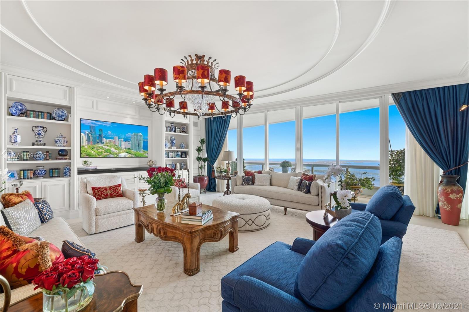 The best flow-thru plan in Santa Maria, residence 4205, sits on the 42nd floor with drop dead gorgeous views spanning from the bay to the city. Completely gutted and renovated and costing over $2 million, it is a must see. The unit offers an open concept kitchen with brand new, never used Gaggenau appliances, soundproofed interior walls, limestone floors in main areas, custom carpets in bedrooms, expensive custom millwork and surround sound system in every room.  The glorious master bedroom has access to the east terrace and enjoys the most beautiful water views all the way to Key Biscayne. There is a well-appointed his and hers marble bathroom and a custom walk-in closet. The two additional bedrooms are en suite and open to the large west-facing terrace.