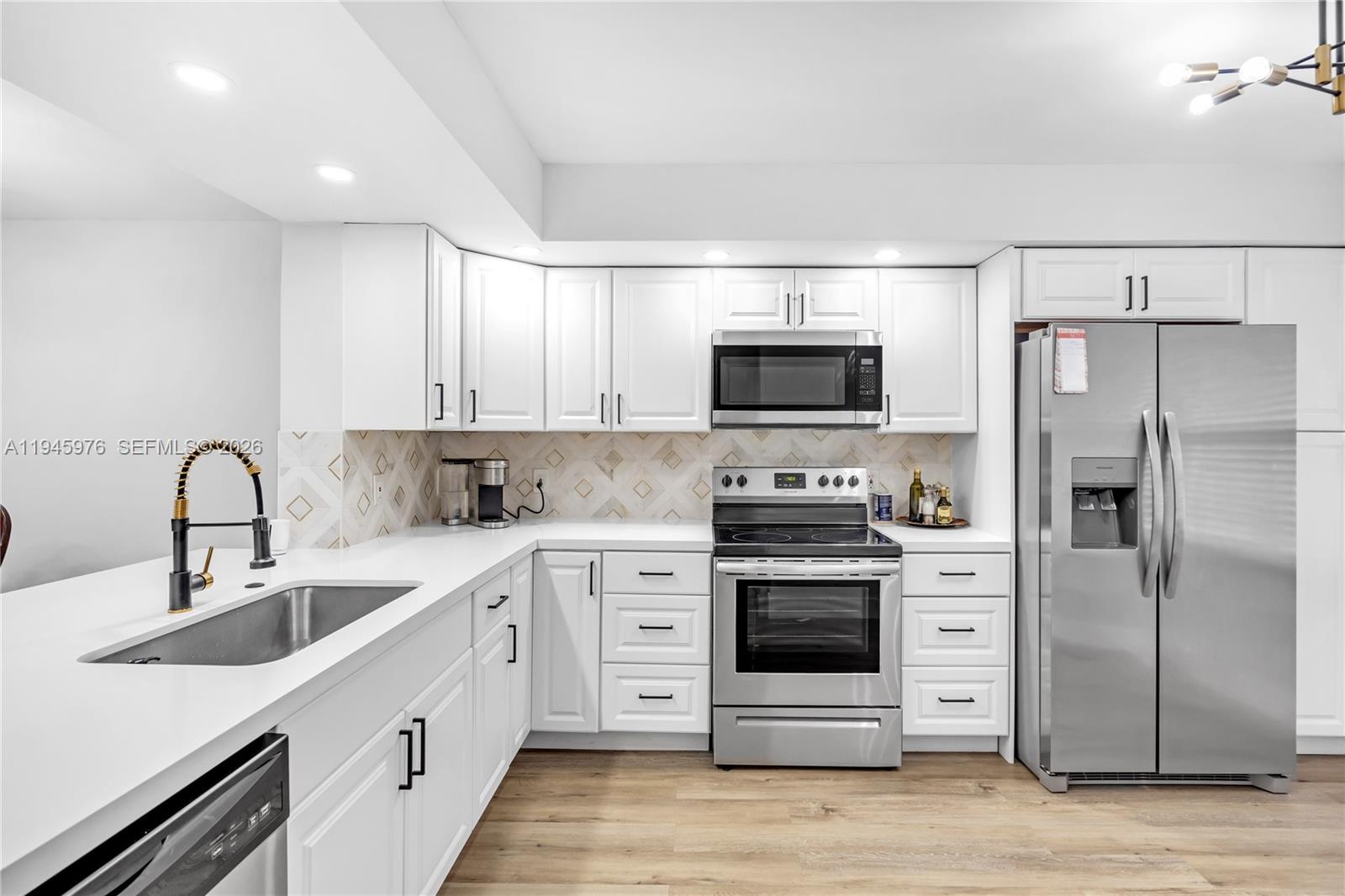 Rarely Available Remodeled 2BR/2BA First-Floor Condo – 1,200+ Sq Ft in Century Village! Spacious and beautifully remodeled 2 bedroom, 2 bathroom first-floor unit with over 1,200 sq ft of living space and an open layout. Enjoy a stunning modern kitchen and comfortable living in this rarely available condo located in Century Village, a premier 55+ community offering resort-style amenities: clubhouse, pools, fitness center, golf, tennis, shuttle service, and more. Conveniently located near major highways,  shopping, and dining. Luxury 55+ living at its finest – don’t miss out! ****VACANT AND  Easy to Show ****Motivated Seller ****